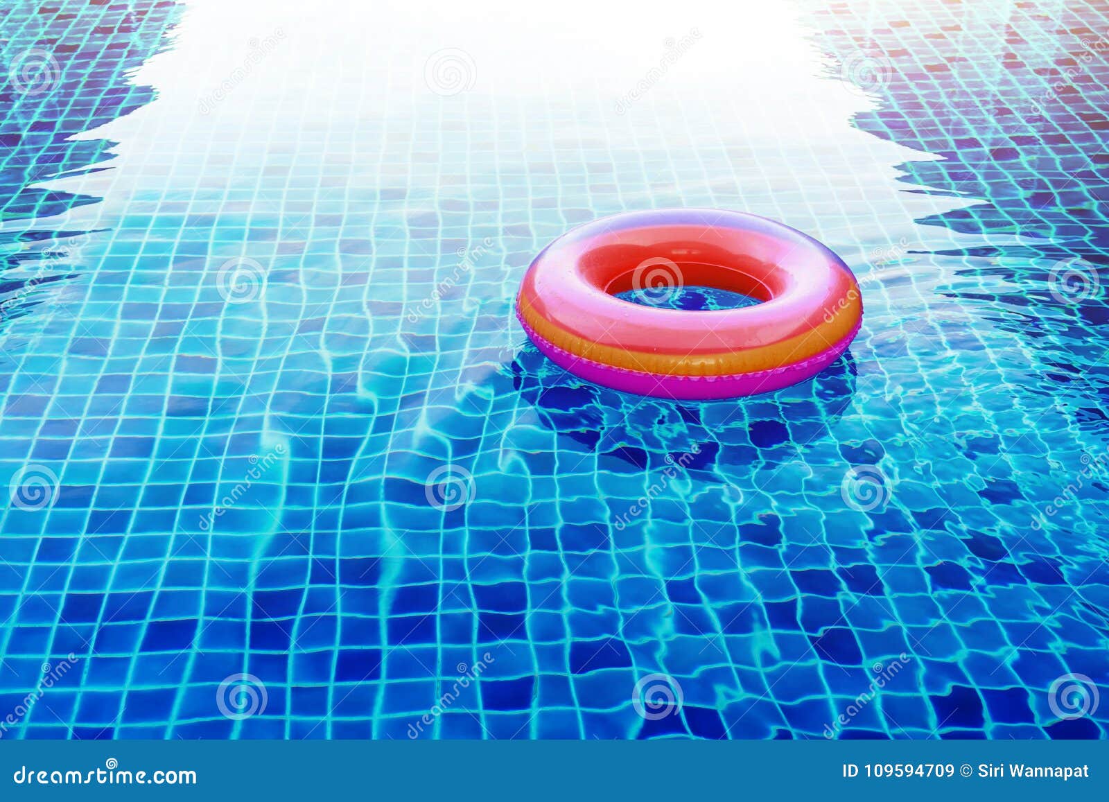 swimming pool ring float over blue water