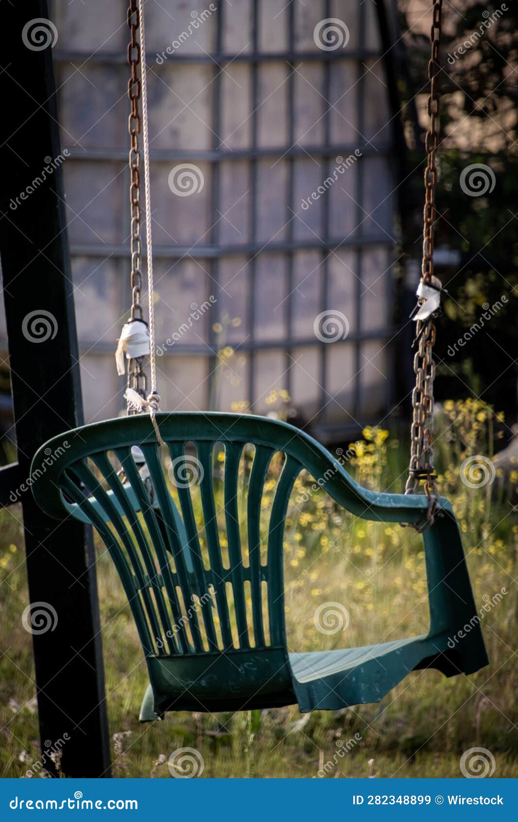 A Swing Made of a Broken Chair and Chains Stock Image Image of