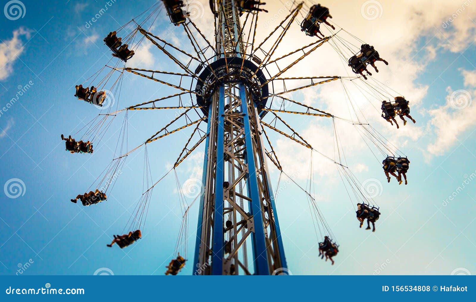 Swings in amusement park stock photo. Image of happy 156534808