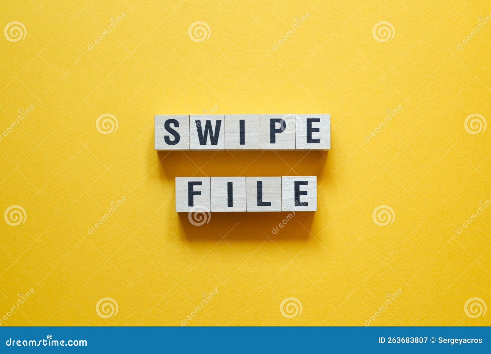 swipe file - word concept on cubes,text
