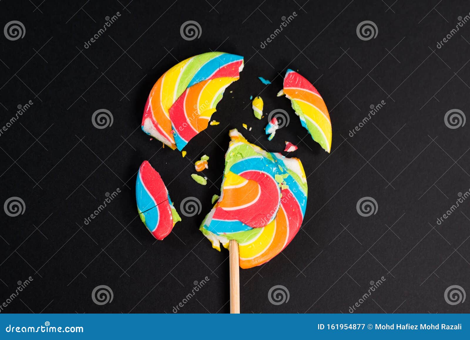 Swirl Round Broken Lollipop on Black Background. Stock Image - Image of ...
