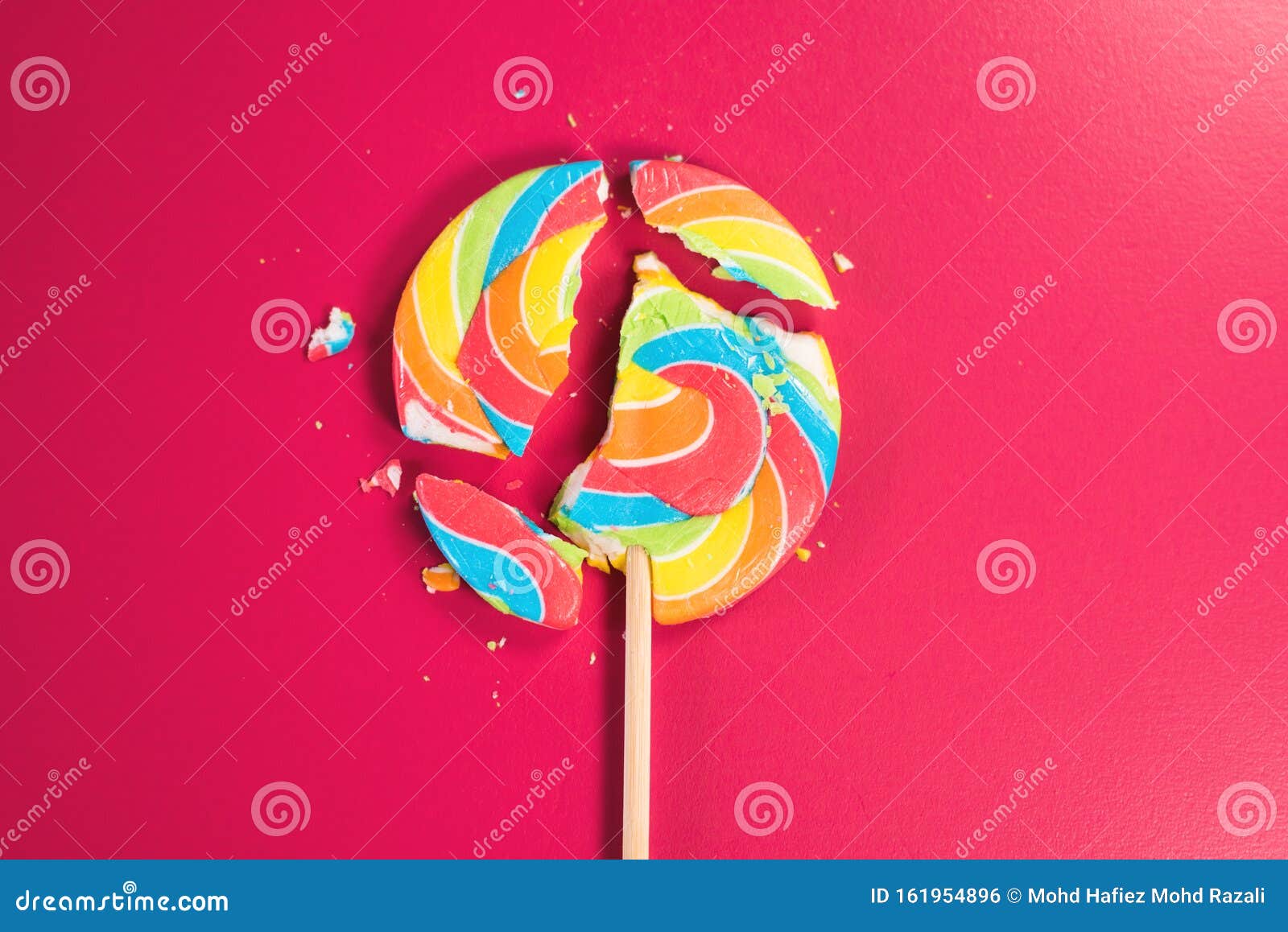 Swirl Round Broken Lollipop on Pink Background. Stock Photo - Image of ...