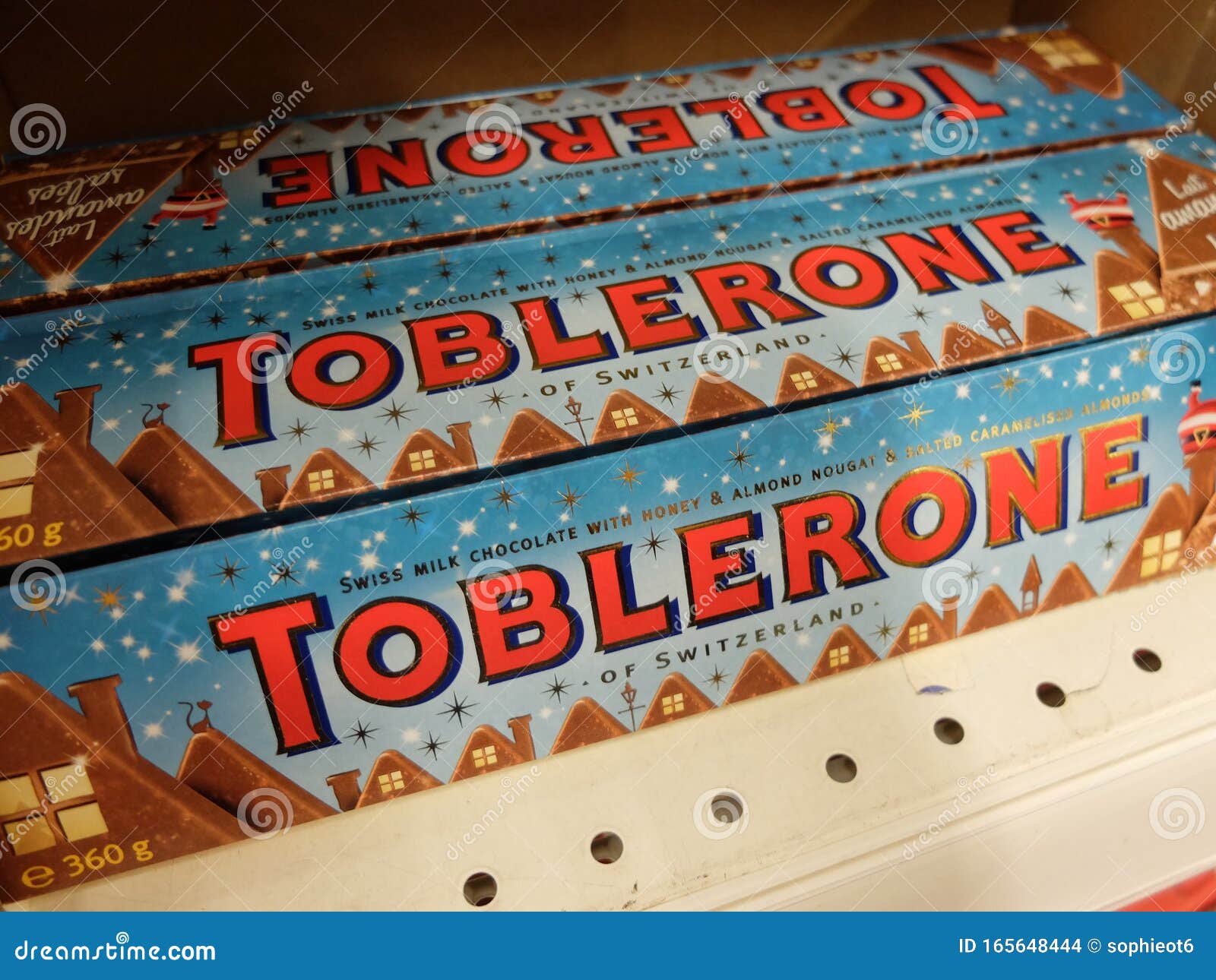 Swiss Toblerone Milk Chocolate with Honey and Almond Nougat and Salted  Caramelized Almonds Chocolate with the Christmas Packaging, Editorial Stock  Image - Image of sweet, avenue: 165648444