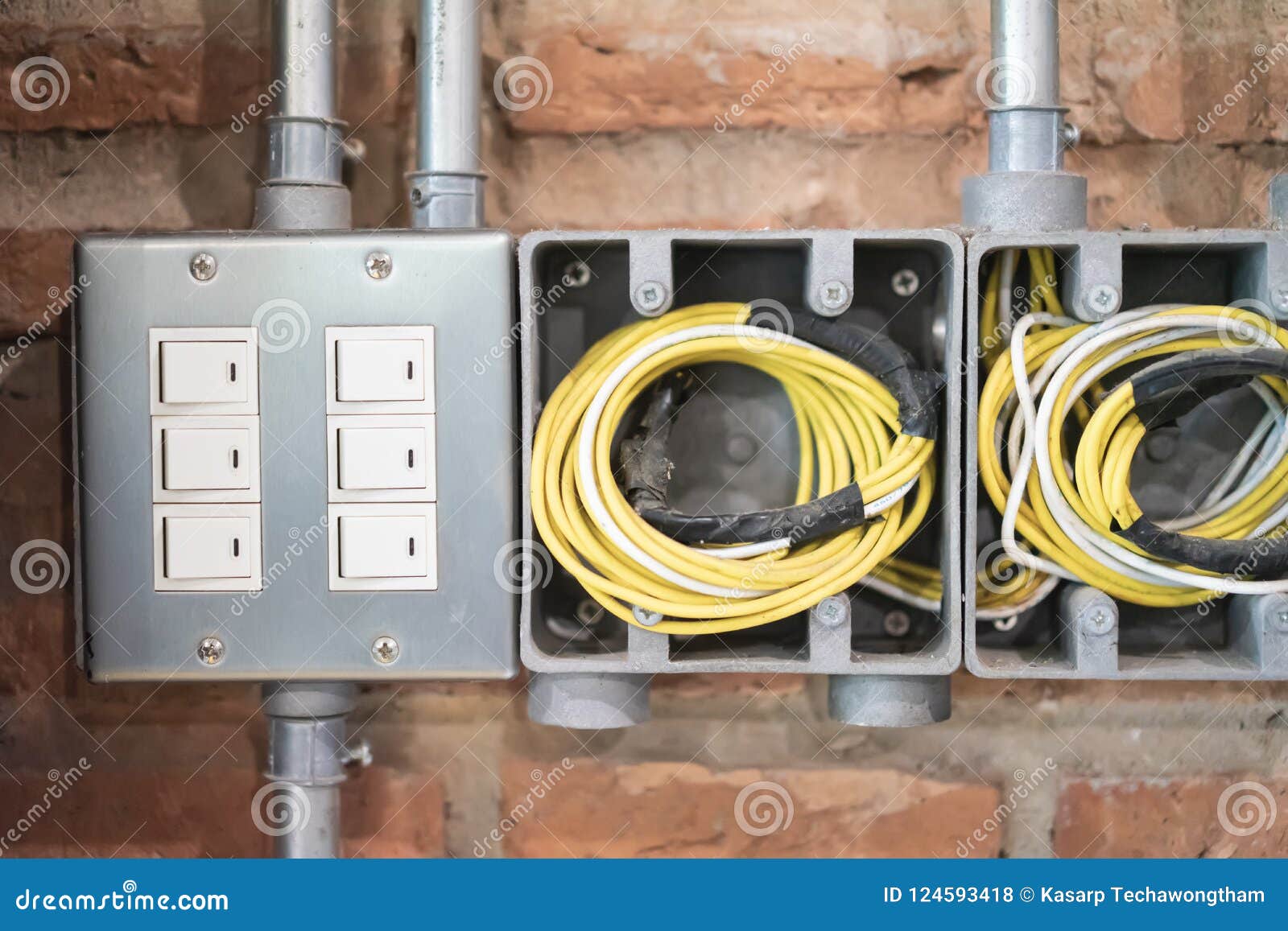 Switch or Power Outlet Set on the Old Vintage Brick Wall Stock Photo