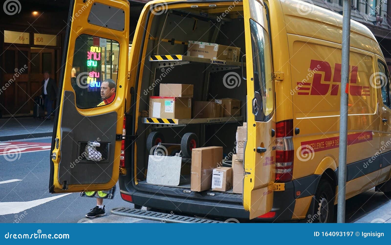 DHL Express Delivery Car Close Up Shot with Open Back Doors, Cardboard  Parcel Boxes on Shelves Being Visible Editorial Photography - Image of  brand, delivery: 164093197