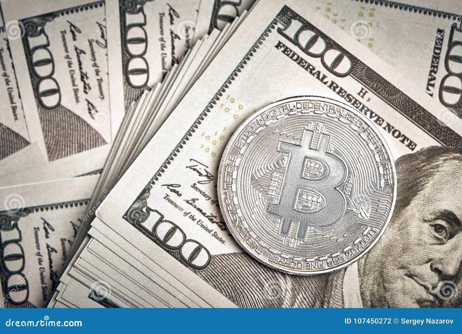 A Symbolic Coins Of Bitcoin On Banknotes Of One Hundred Dollars - 