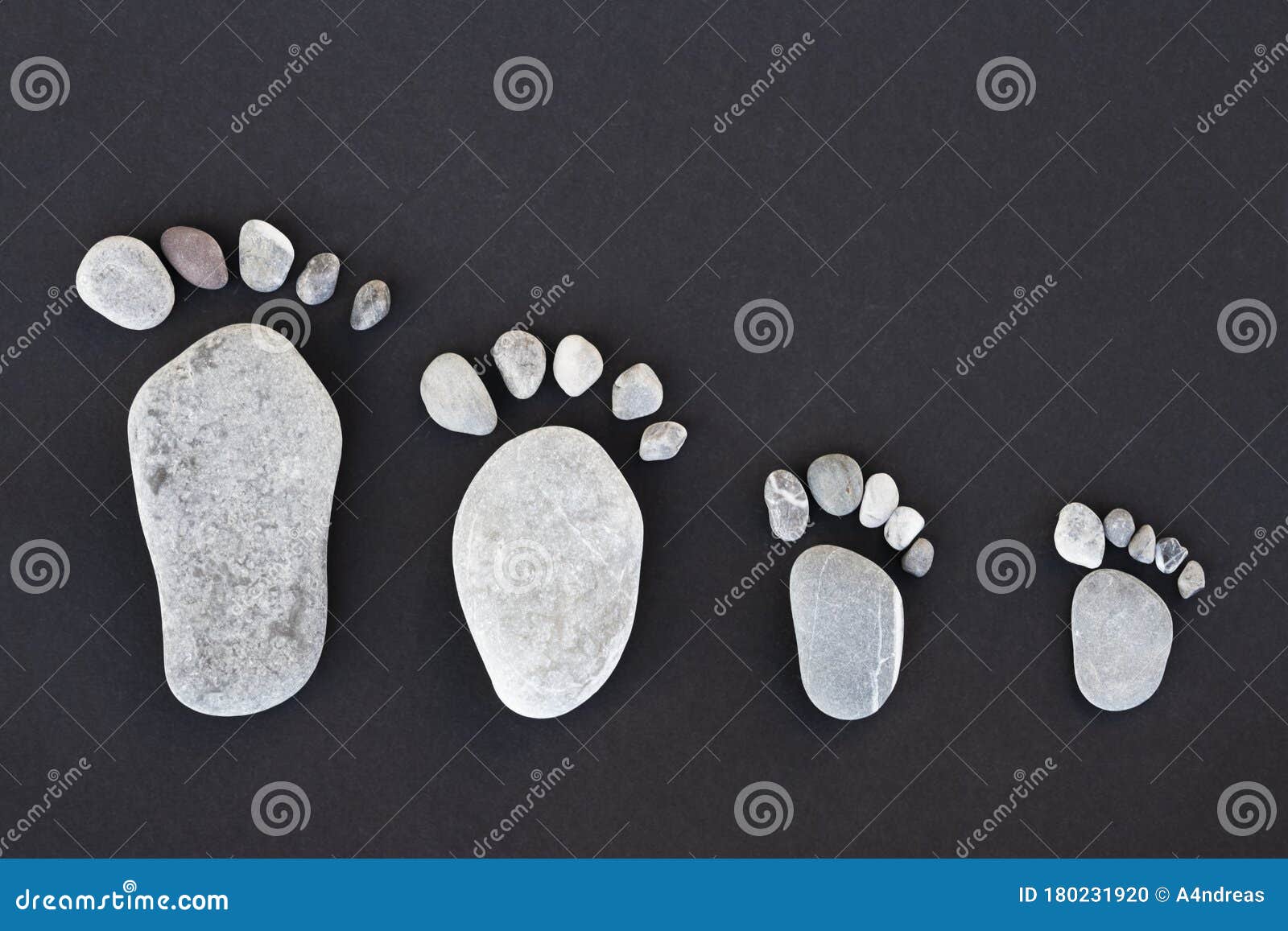 ic lime stones forming stone foots of parents and two kids