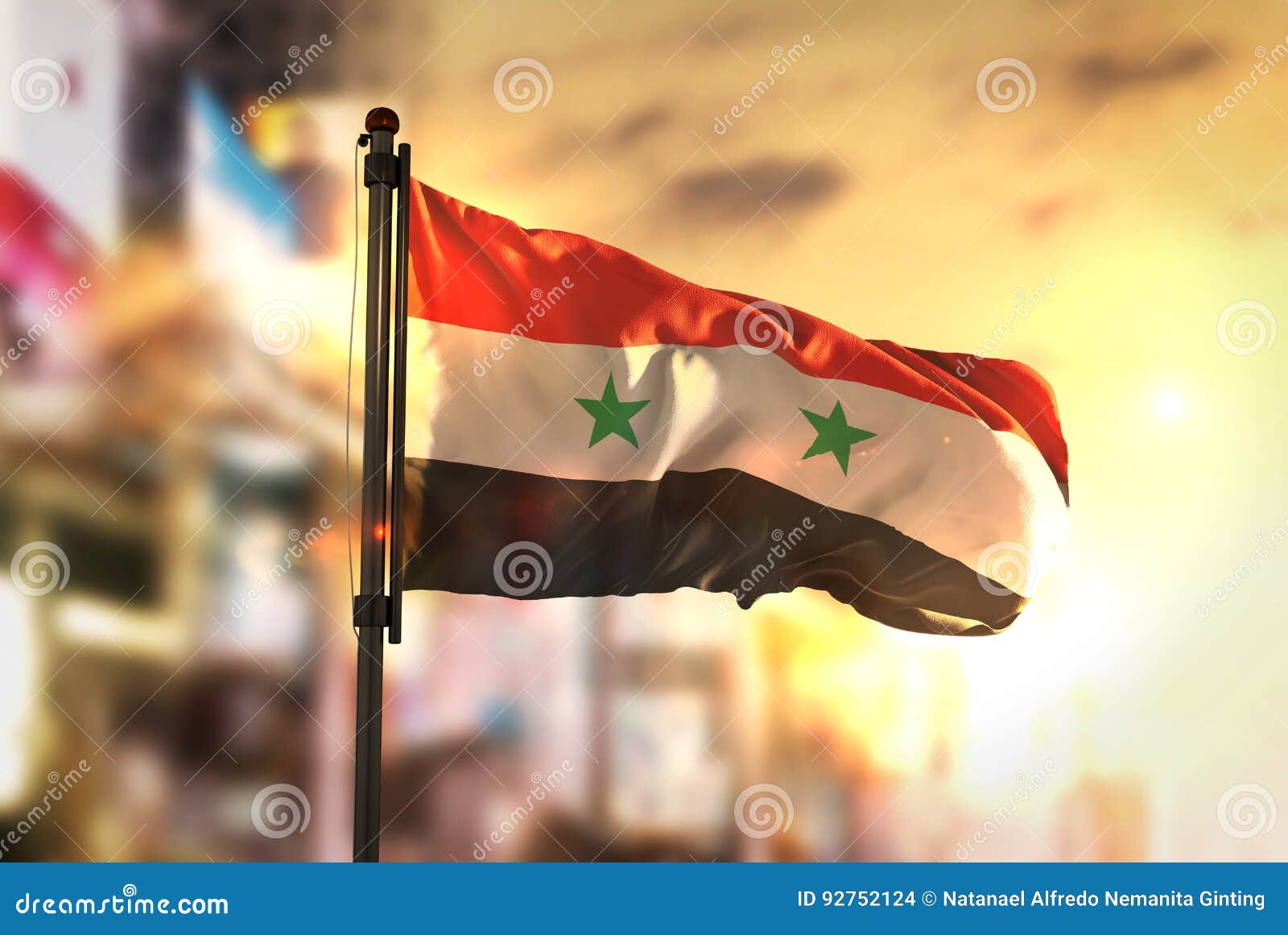 Flag of Syria on a Flagpole Flutters in the Wind Against the Sky