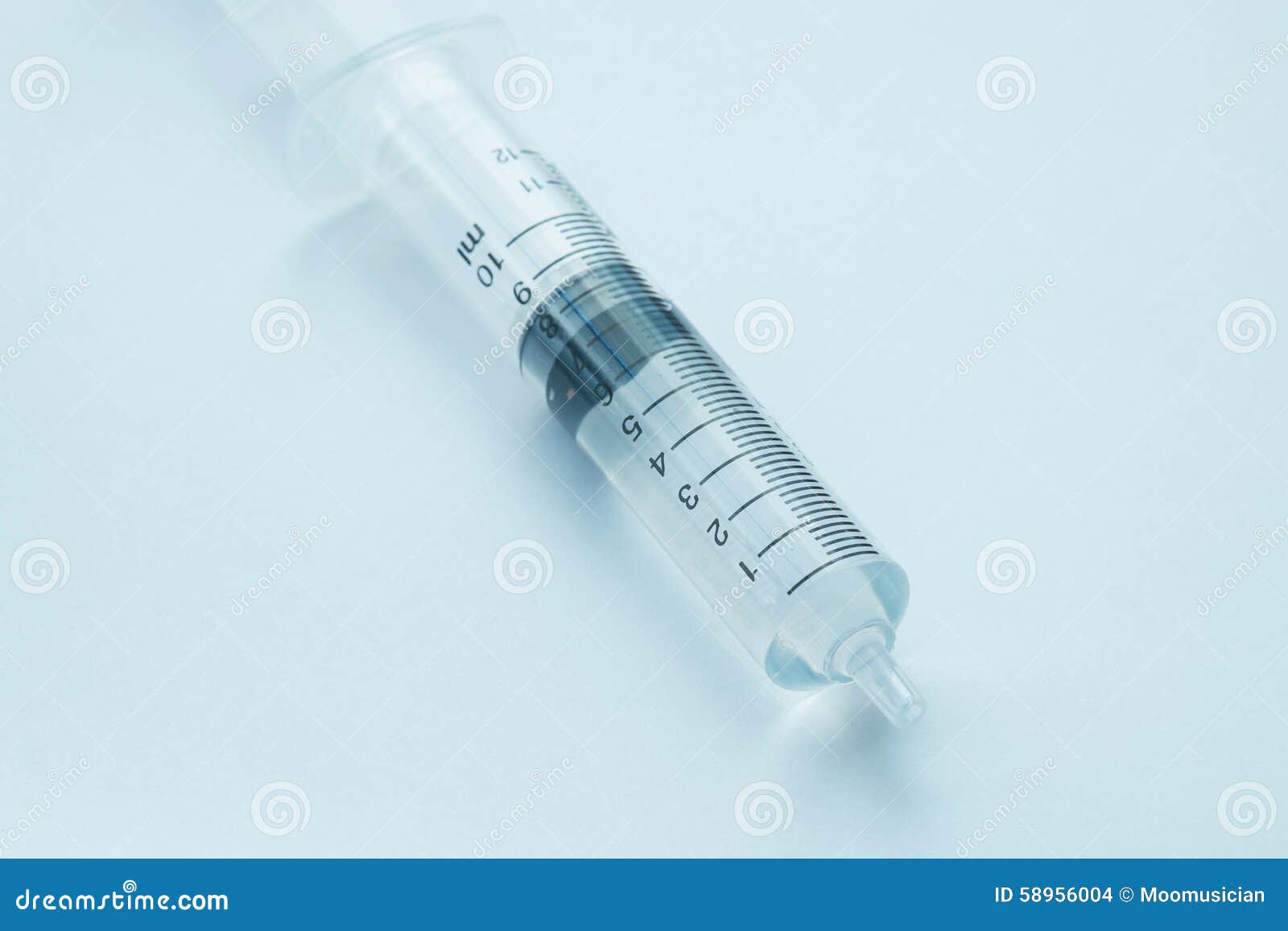 Syringe with clear liquid stock photo. Image of closeup - 58956004
