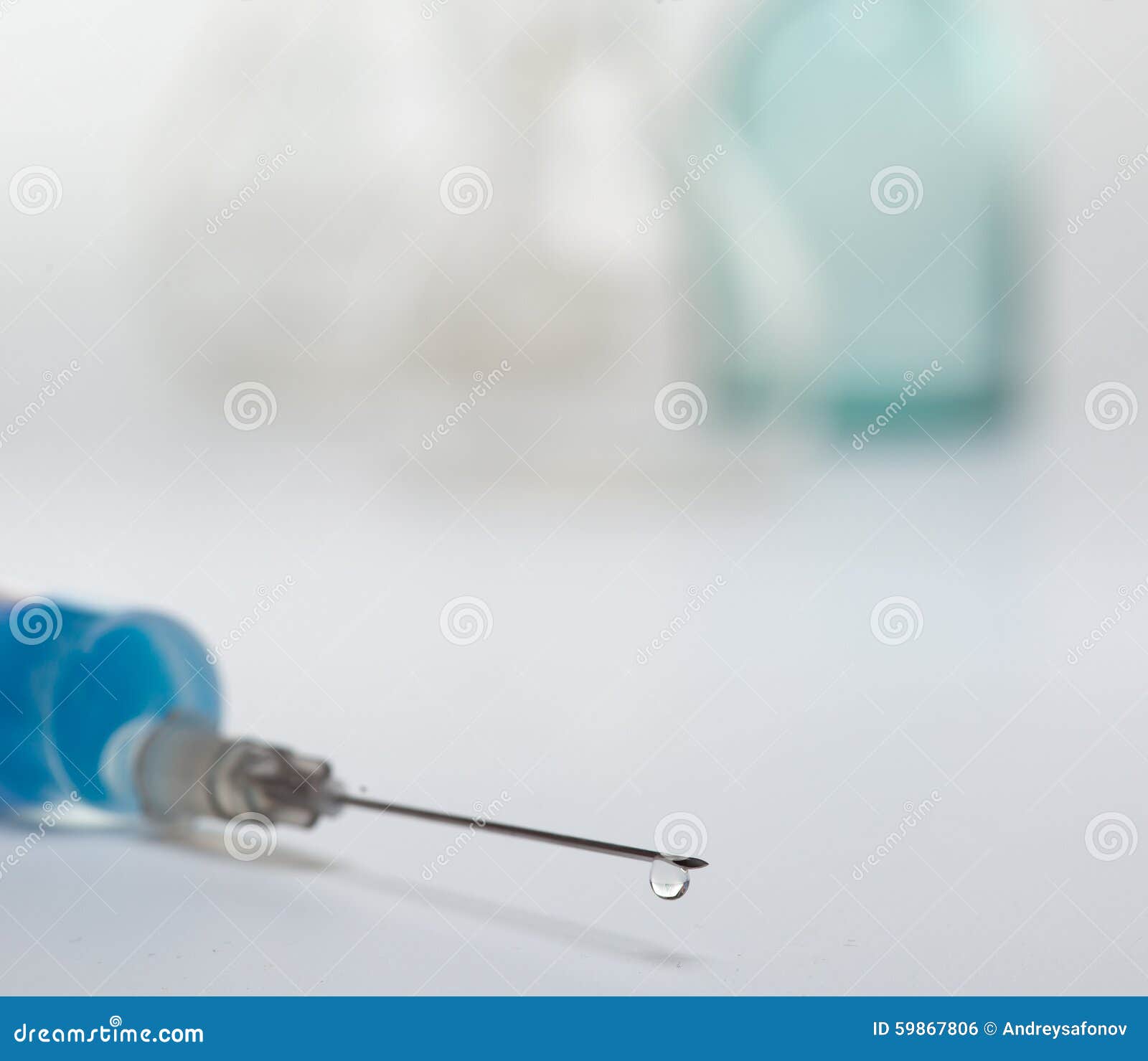 A Syringe with a Drop on the End of the Needle Stock Photo Image of
