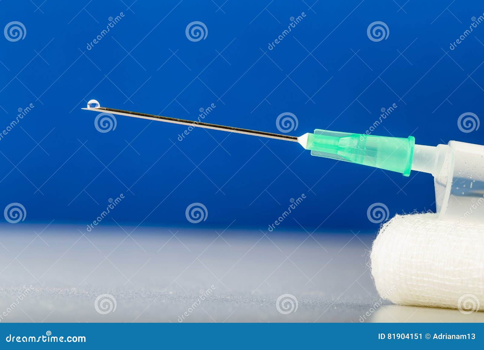 Syringe on Gauze with Drop on Top of Needle. Medical Tools Stock Image