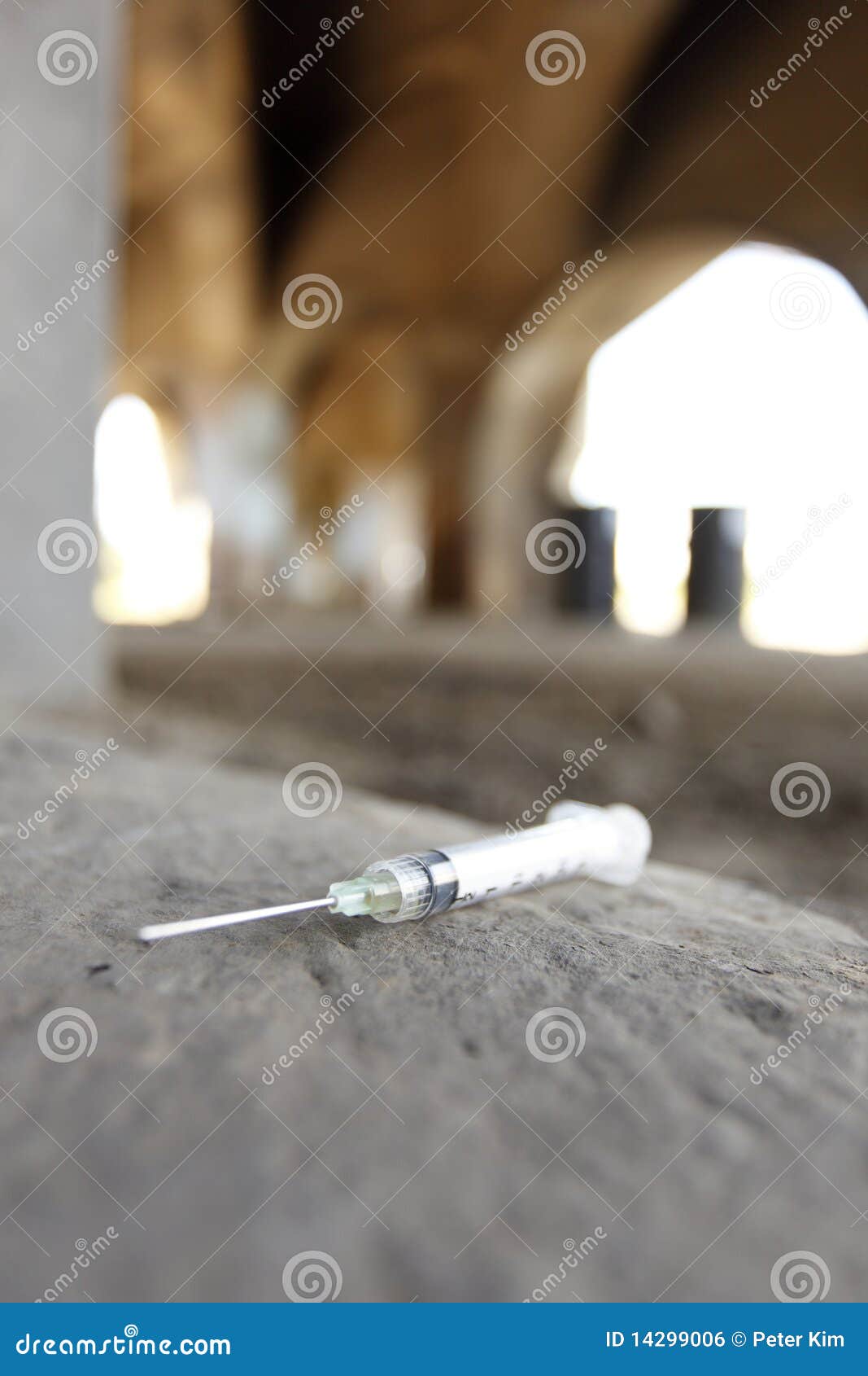 Syringe on the ground stock photo. Image of addiction 14299006
