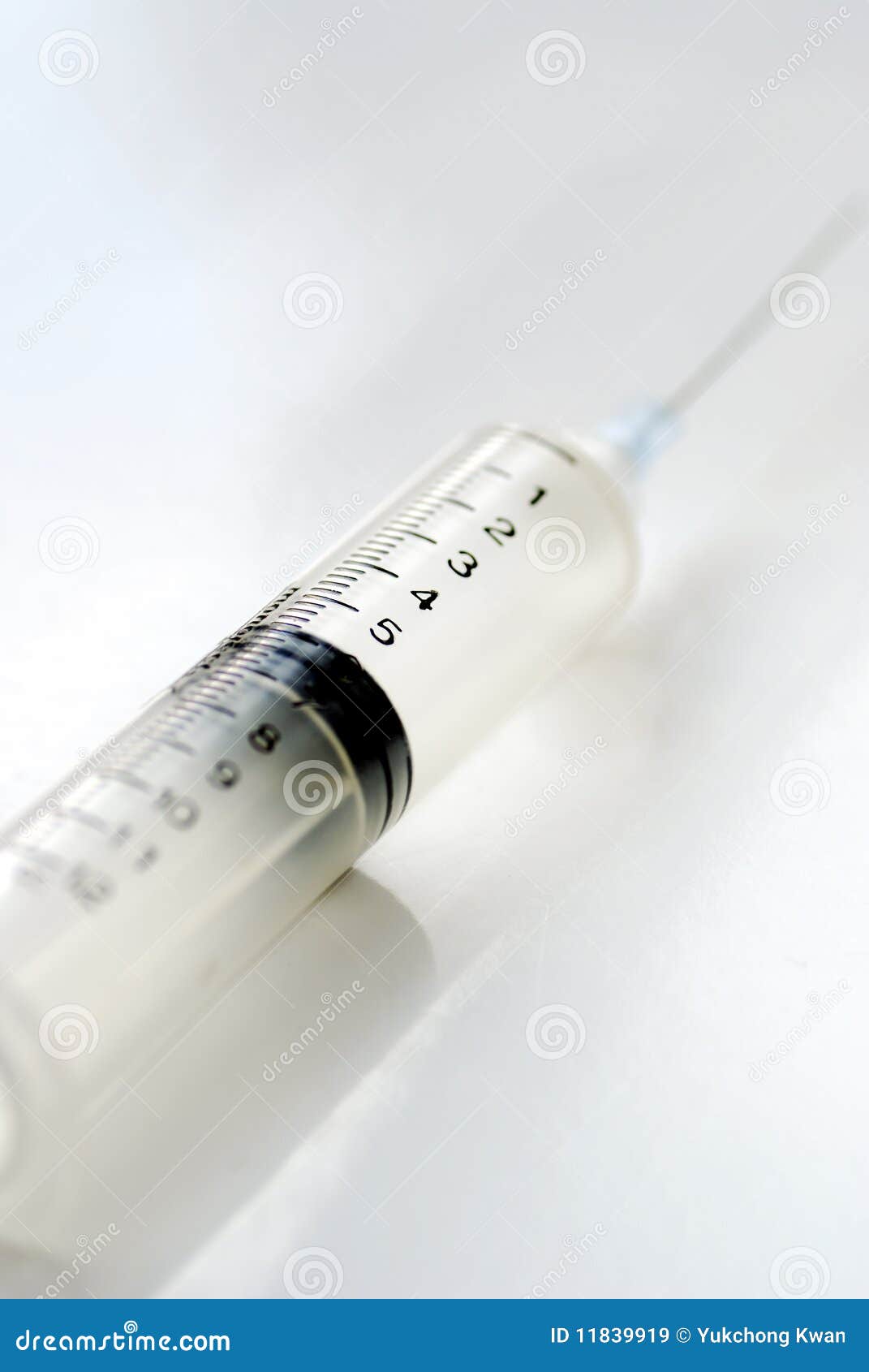 syringe with hypodermic needle  on white