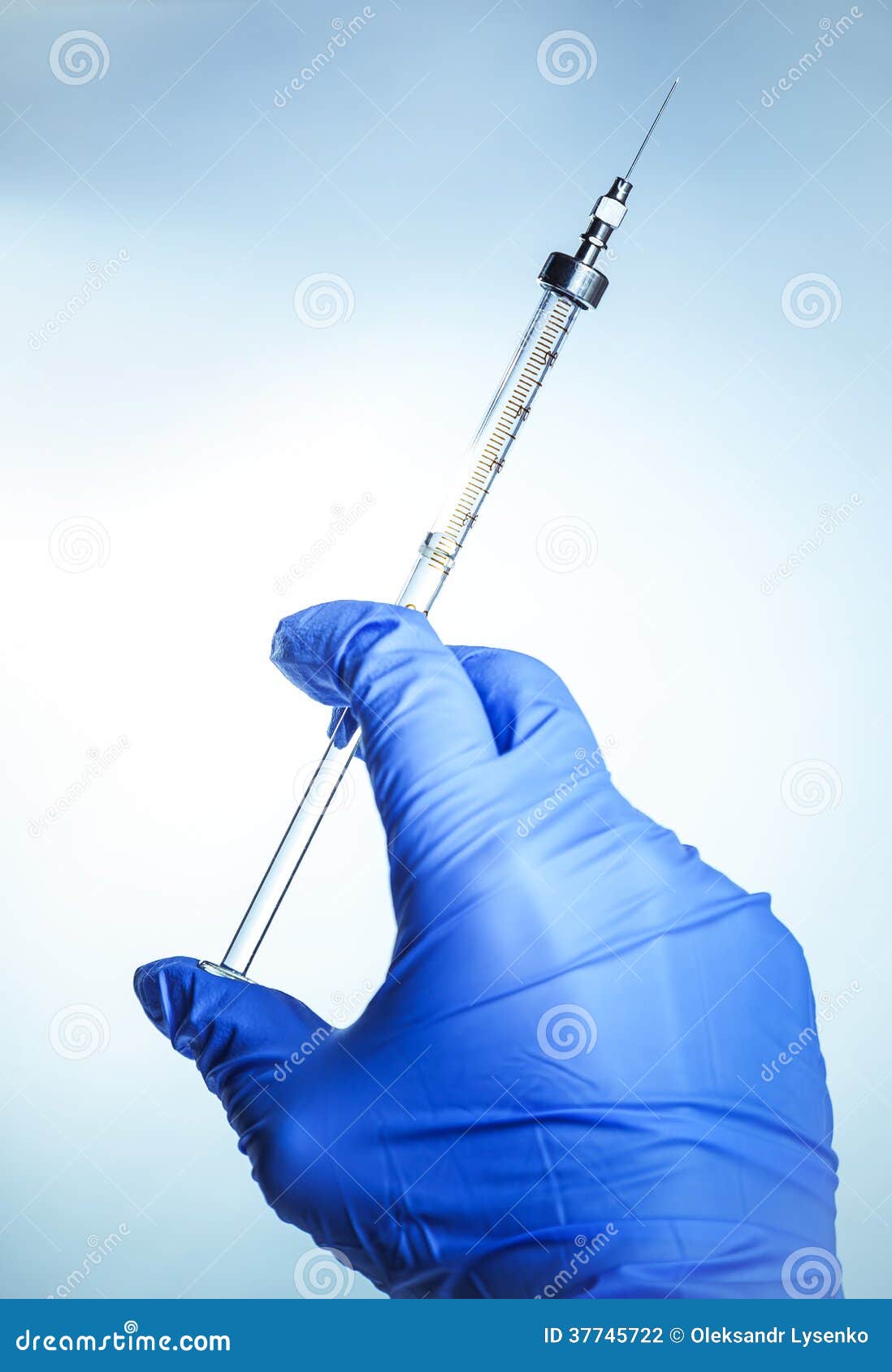 Syringe with vaccine in hand experienced doctor