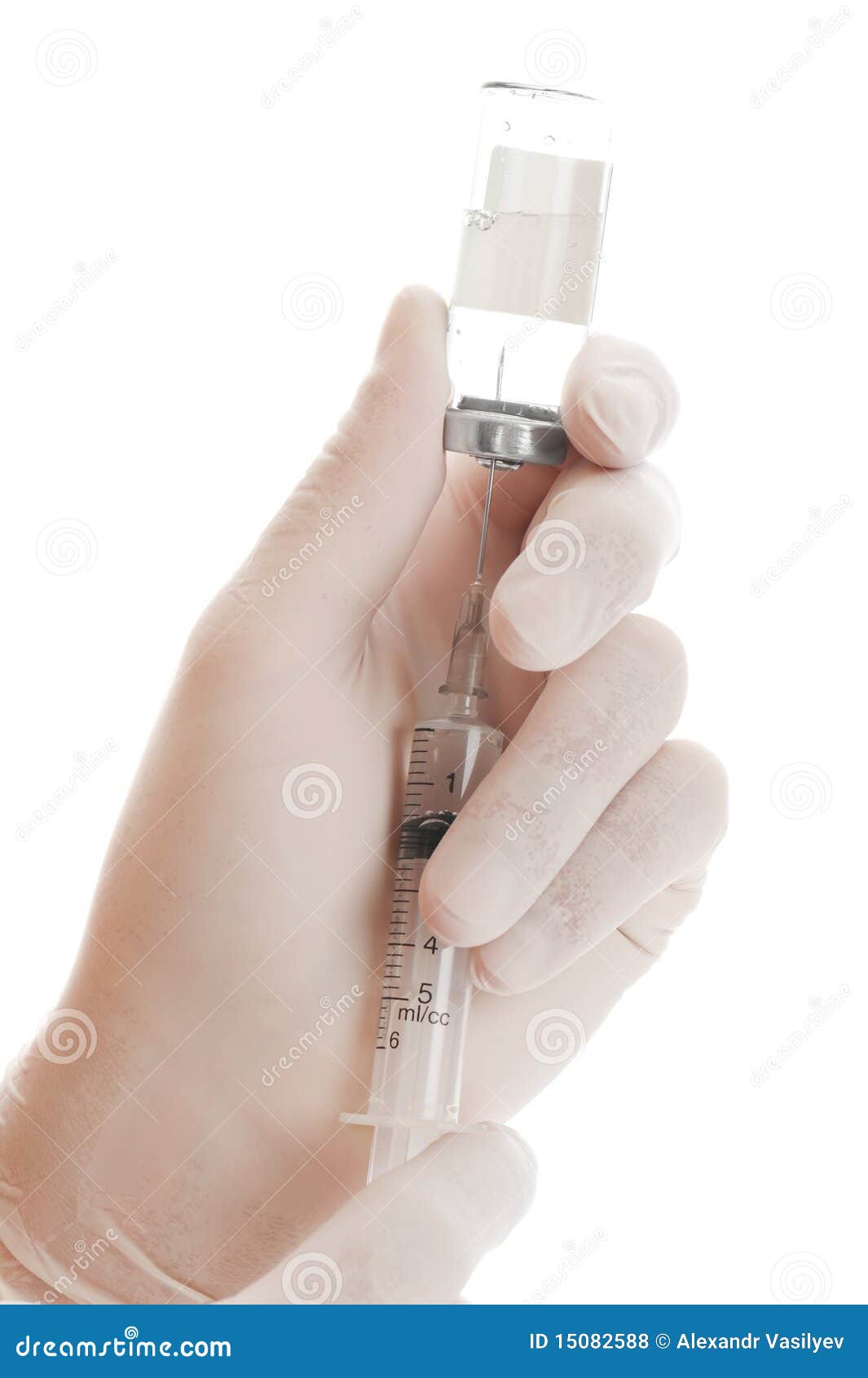 syringe and vial in hands