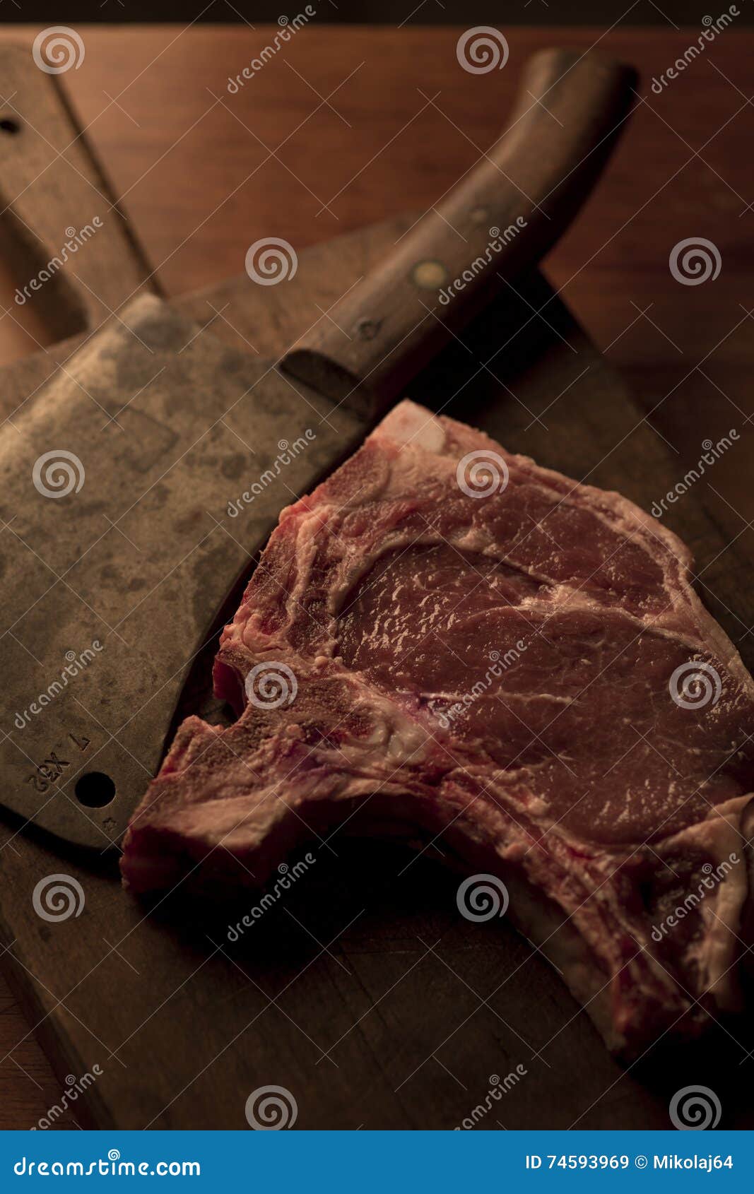 Tbone Roast Beef Steak with a Vintage Cleaver on a Cutting Boar Stock