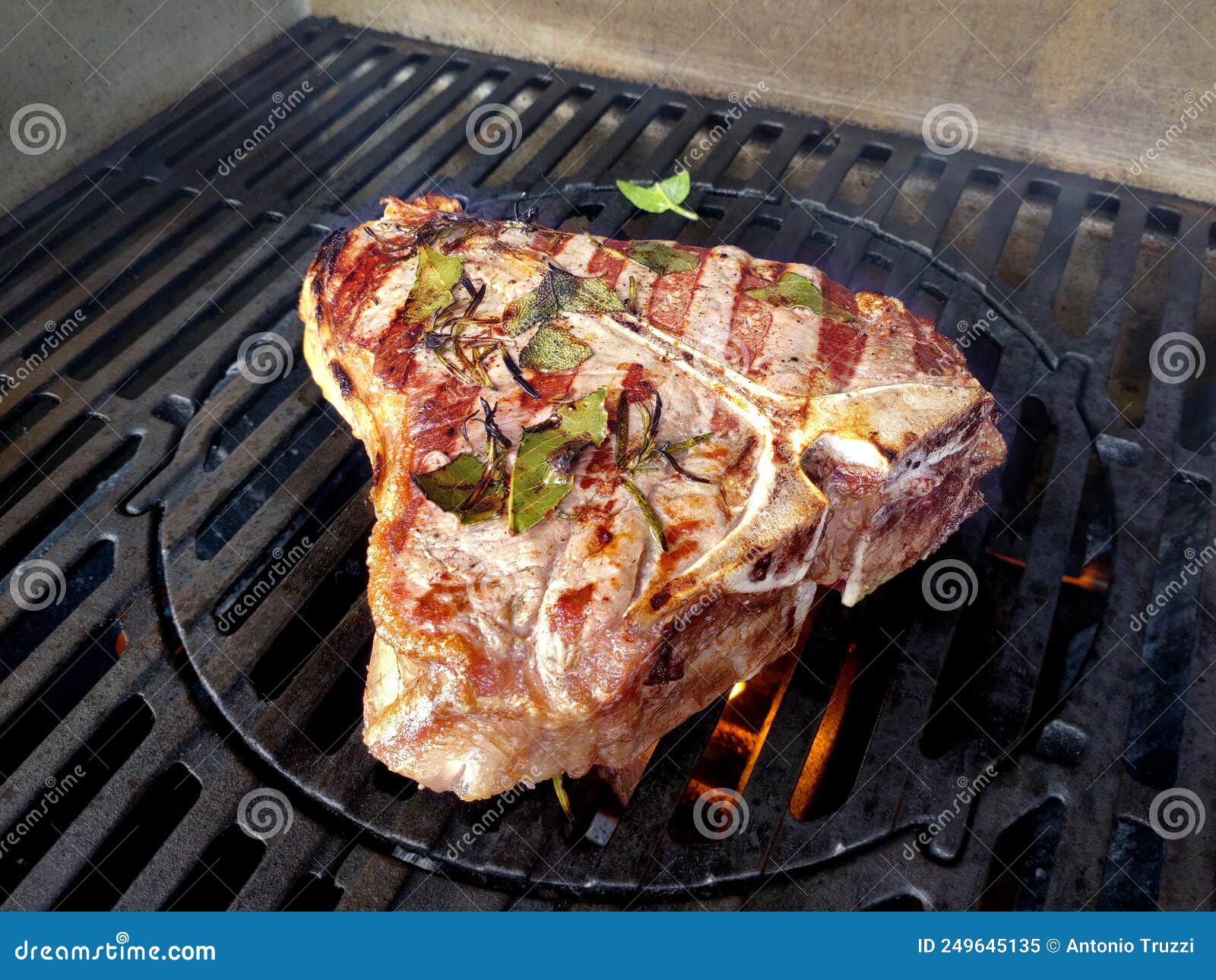 Tbone Steak Flavored with Herbs Cooks on the Grill Stock Image Image