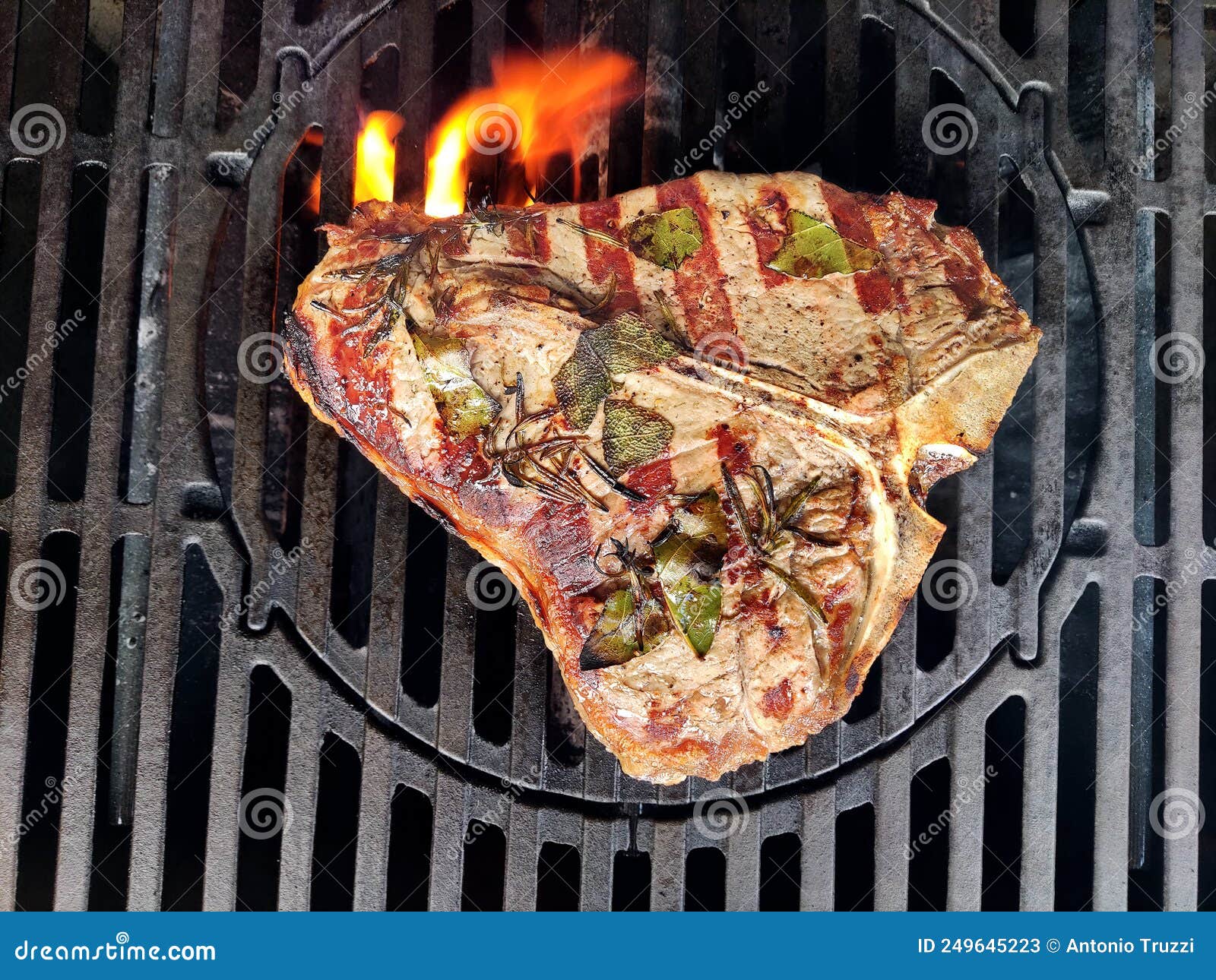 Tbone Steak Flavored with Herbs Cooks on the Grill Stock Image Image