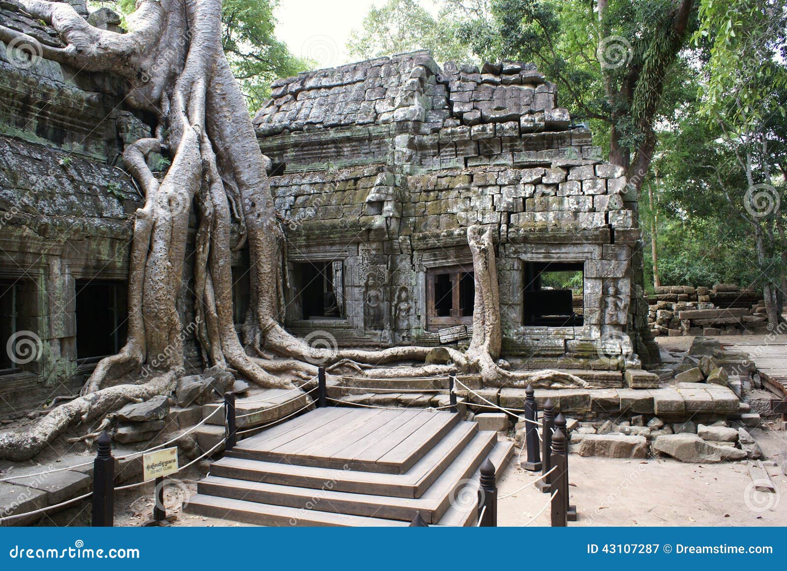 Ta Prohm Angkor. Ta Prohm temple Anghor in Cambodia. The work of Jayavarman VII and dedicated to Buddhism. Many buildings are covered with roots of the banyan and kapok trees.