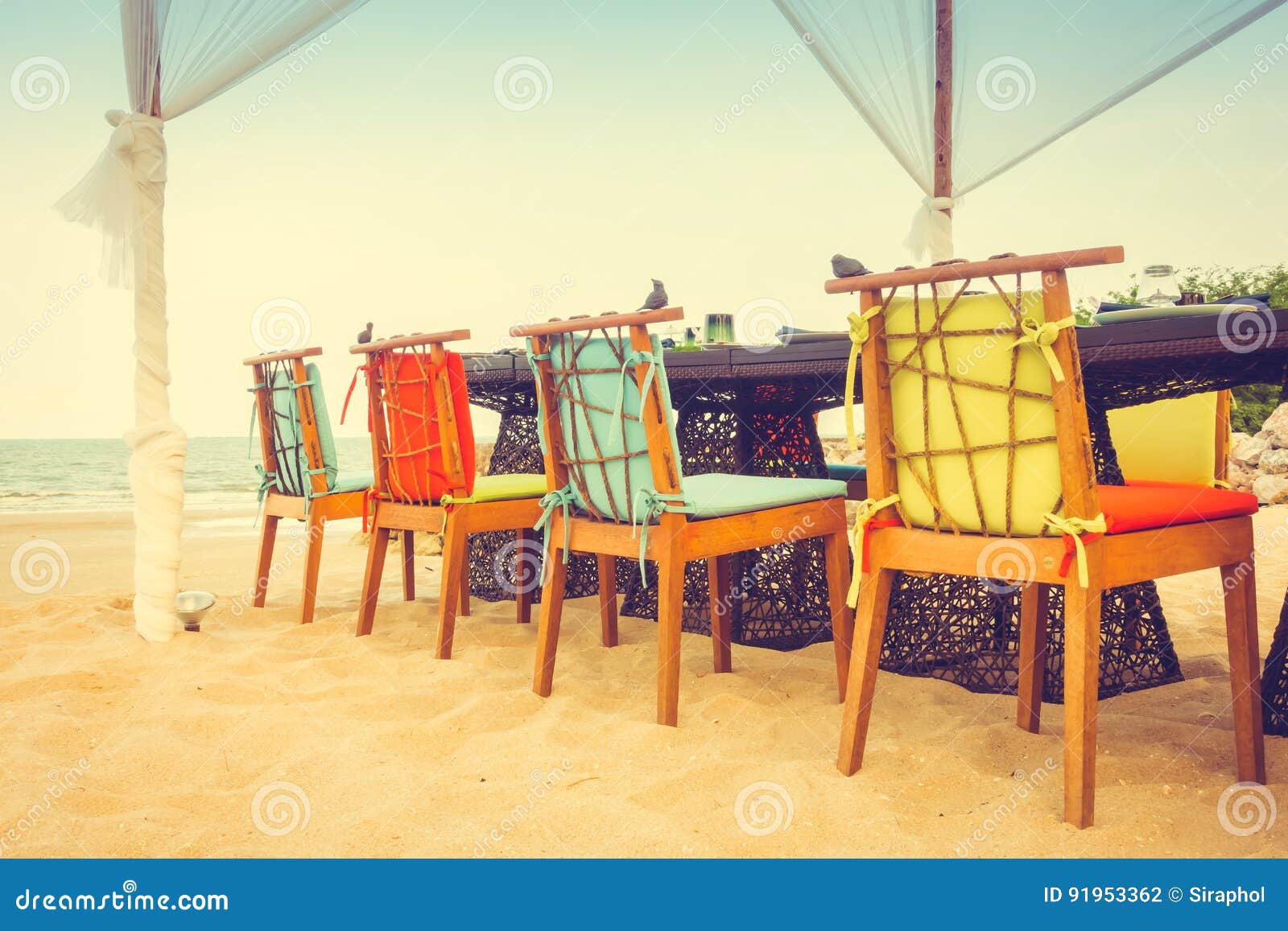 Table and Chair Set on the Beach for Dinner Stock Photo Image of celebration, outdoor 91953362