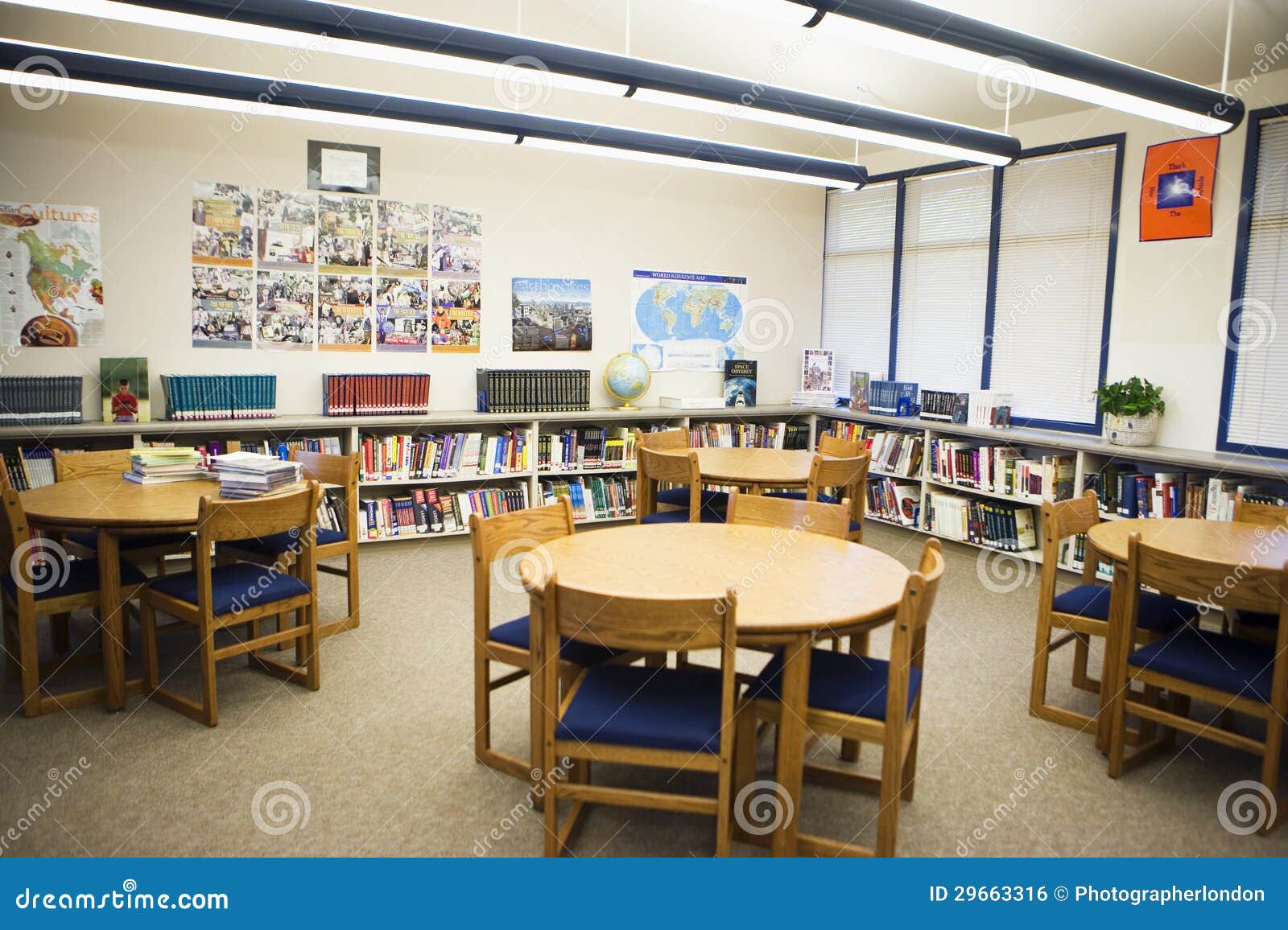 table and chairs arranged in high school library