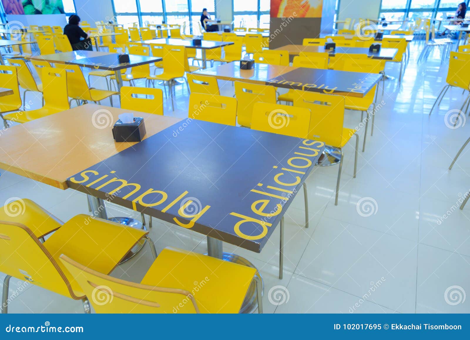 Table and Chairs in the Canteen and Employees Sit by the Window. Stock