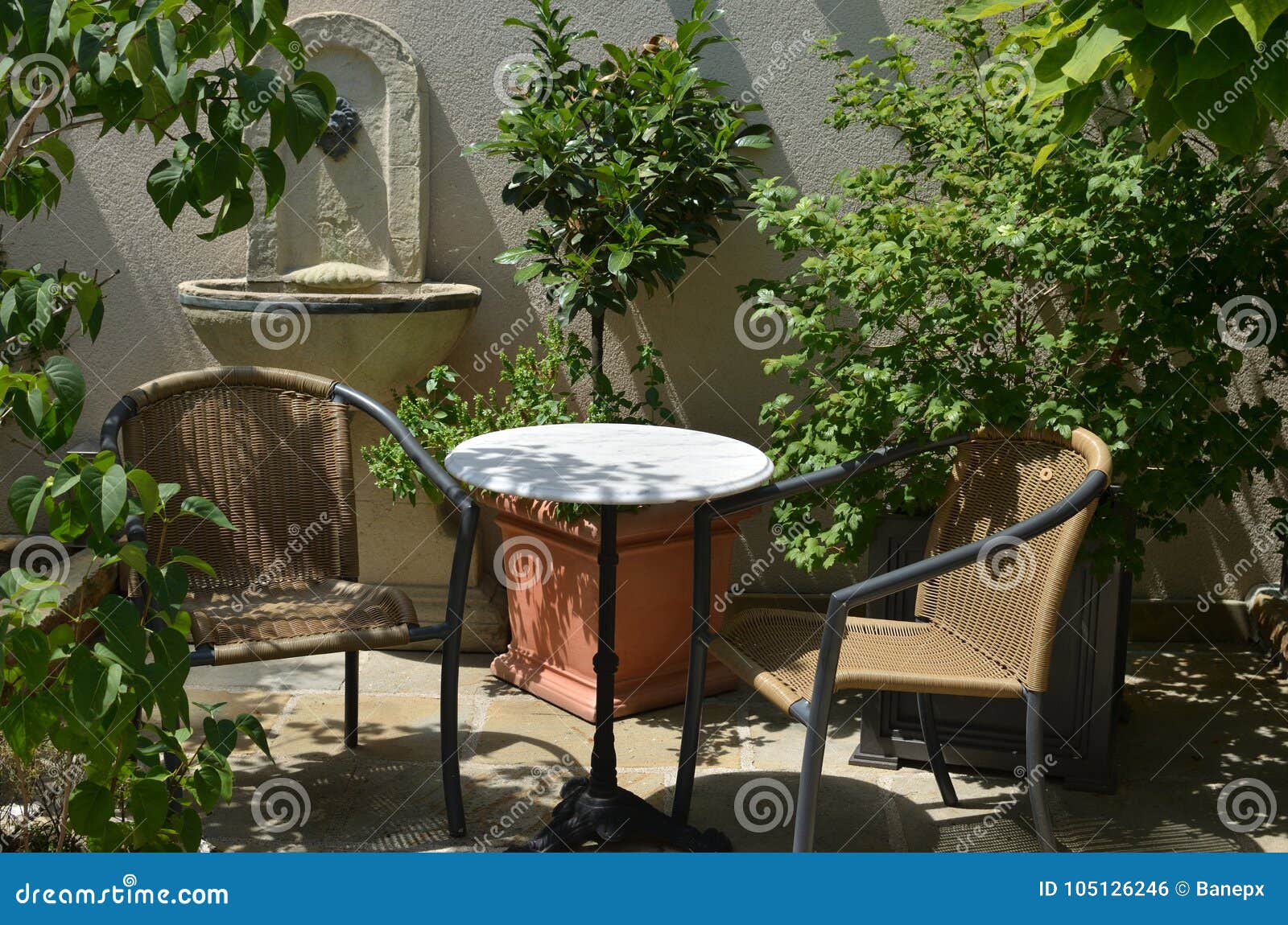 Table and chairs in garden stock photo. Image of monument - 105126246