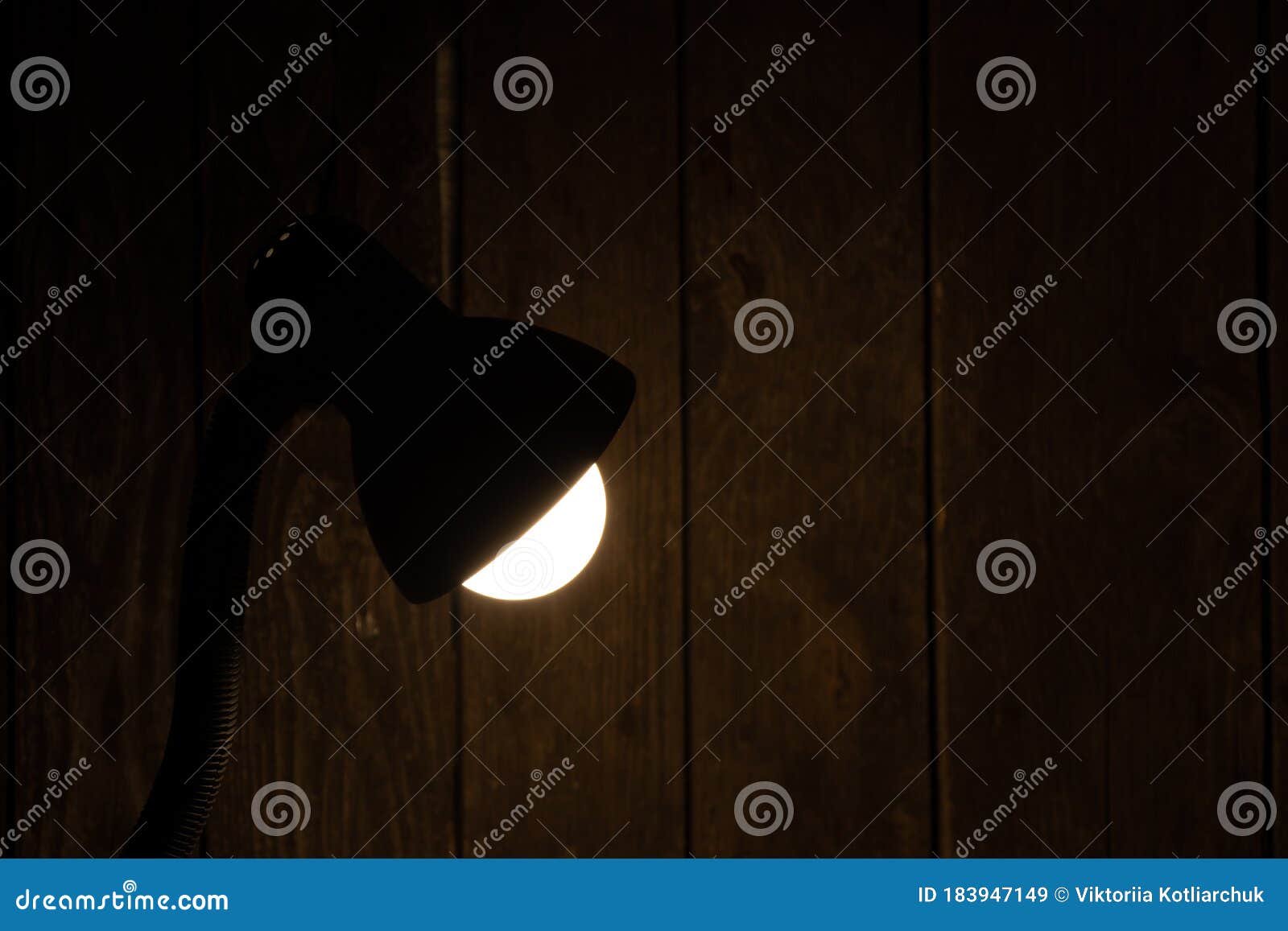 Table Lamp on in a Dark Room on the Table Illuminates the Place Stock Image Image of