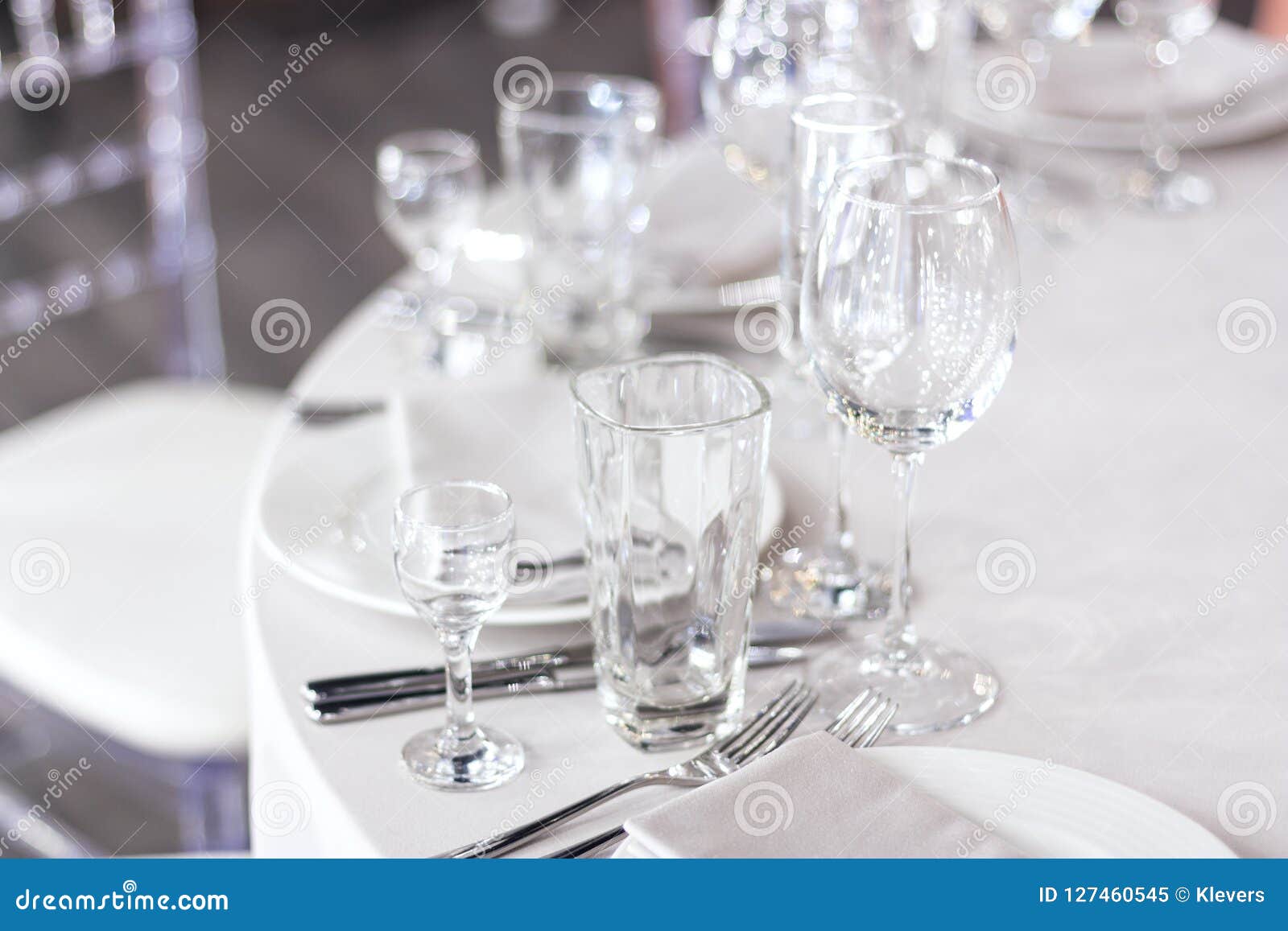 The Table is Set with a White Tablecloth in the Restaurant Stock Image