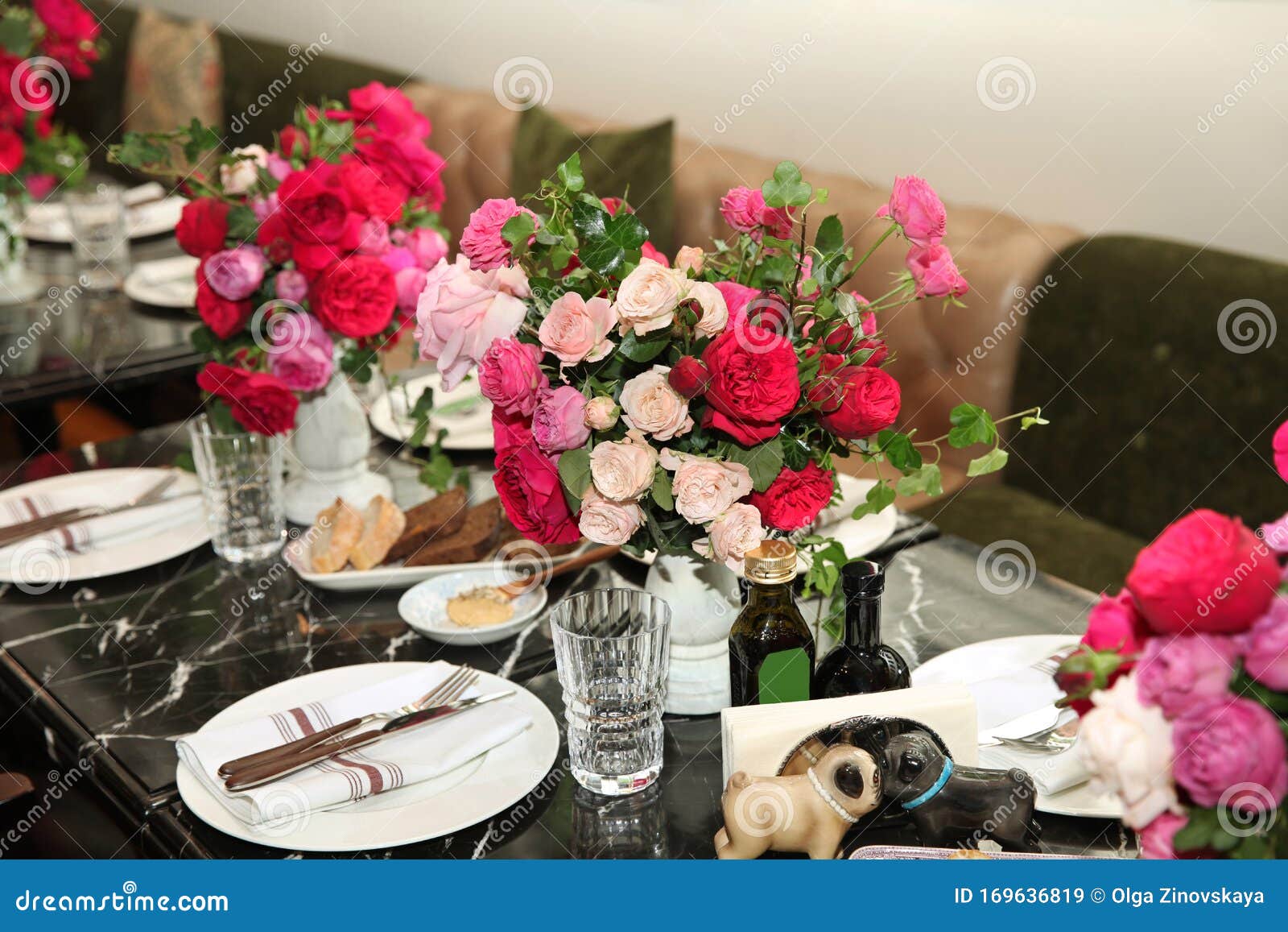 Table Setting with Bouquets of Flowers with Pink and Red Roses on the