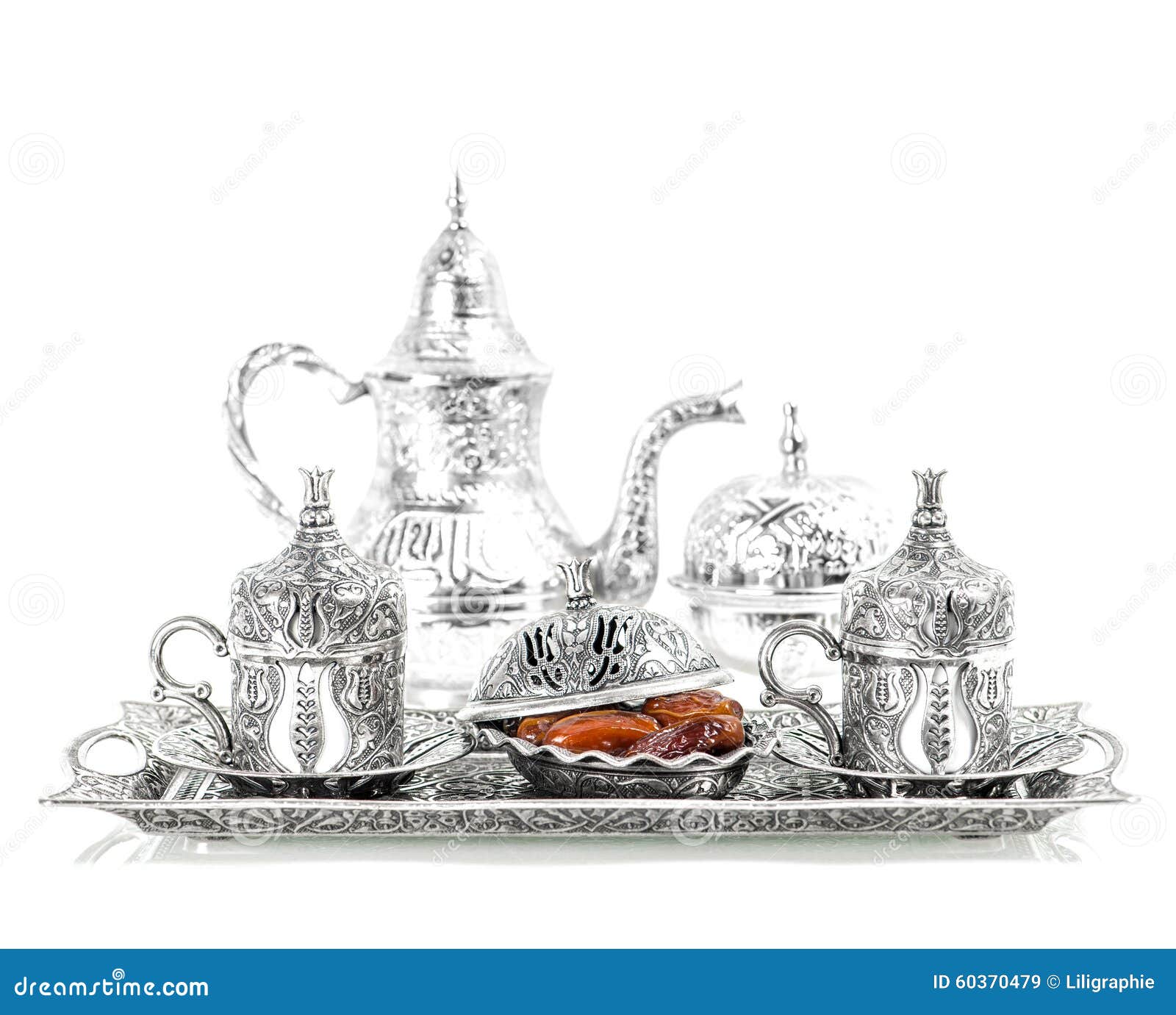 table setting with silver tableware. oriental hospitality