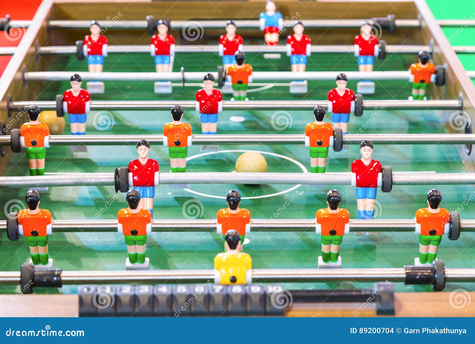Table Soccer or Football Kicker Game with Player Figures. Stock Photo