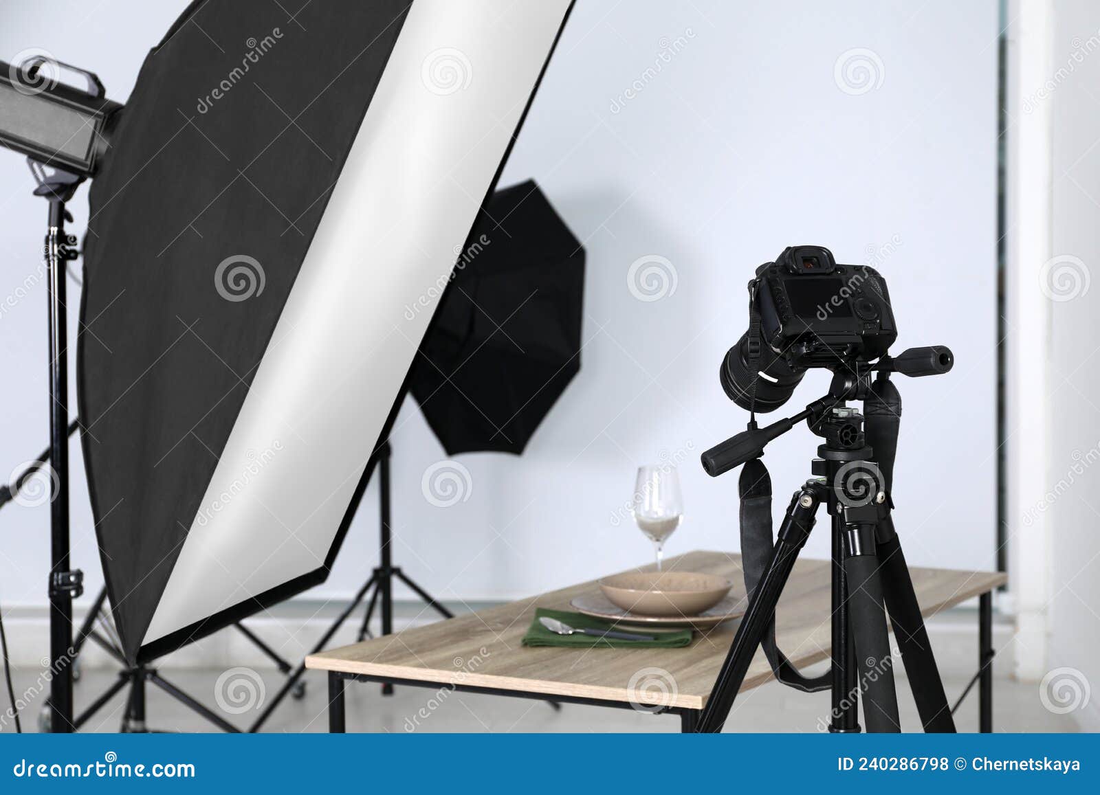 Table with Stylish Dinnerware in Front of Camera and Professional