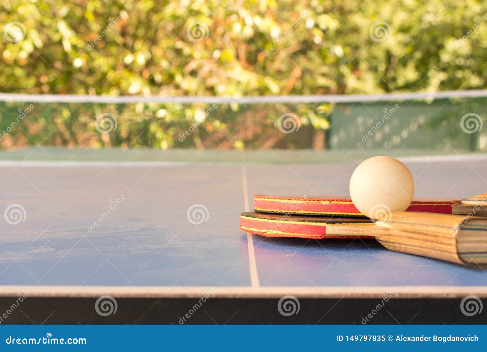 Table Tennis Rackets and a Ball on the Table Stock Image Image of
