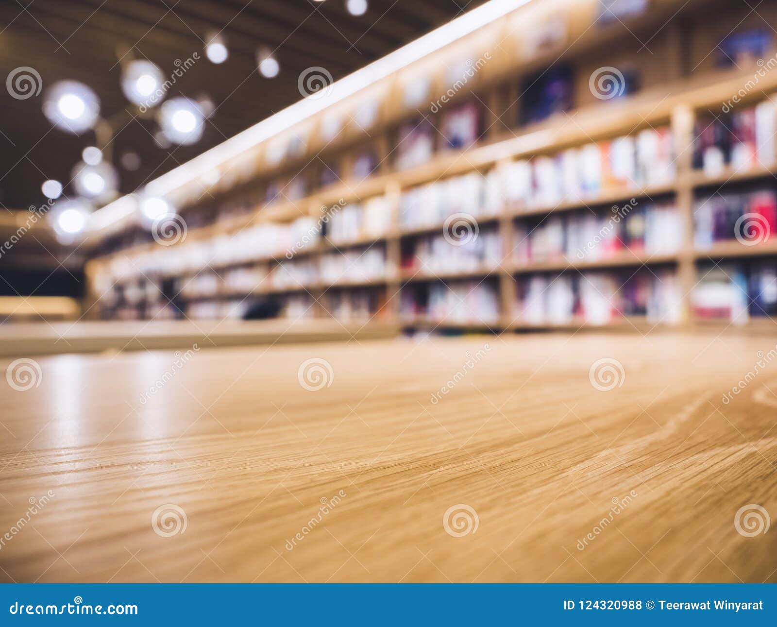 Table Top Counter With Blur Bookshelf Bookstore Background Stock