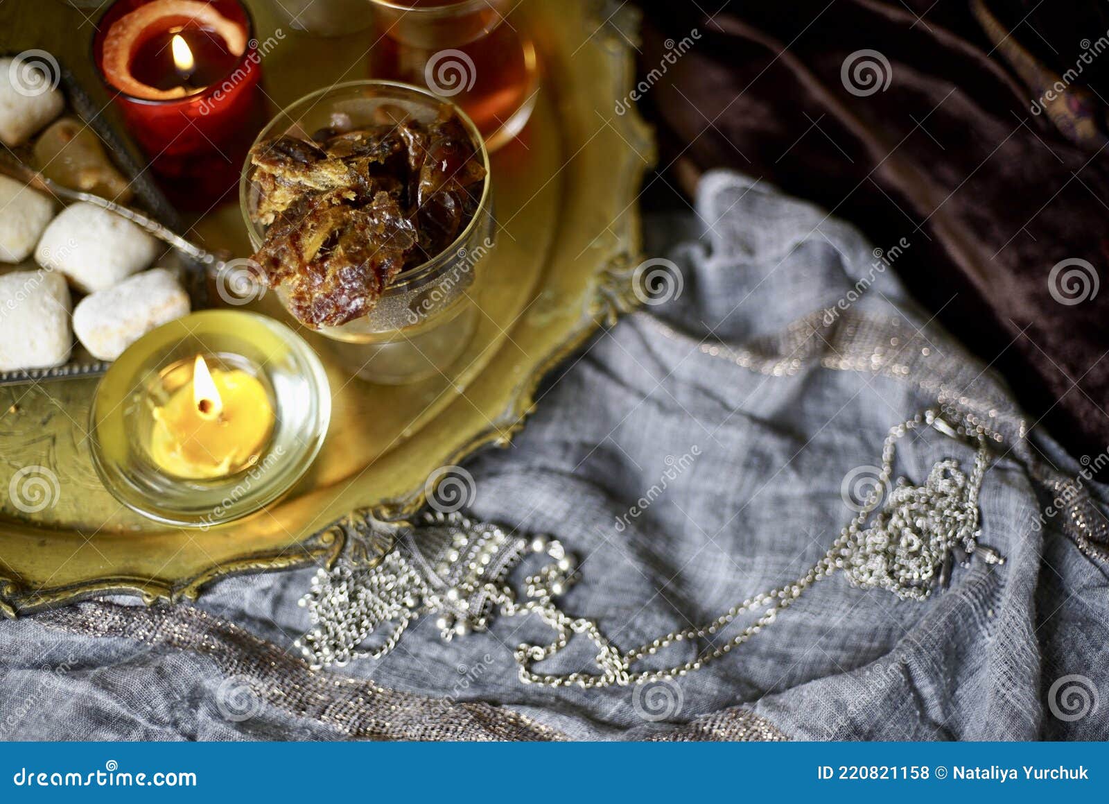 a table with turkish tea with lale, oriental sweets