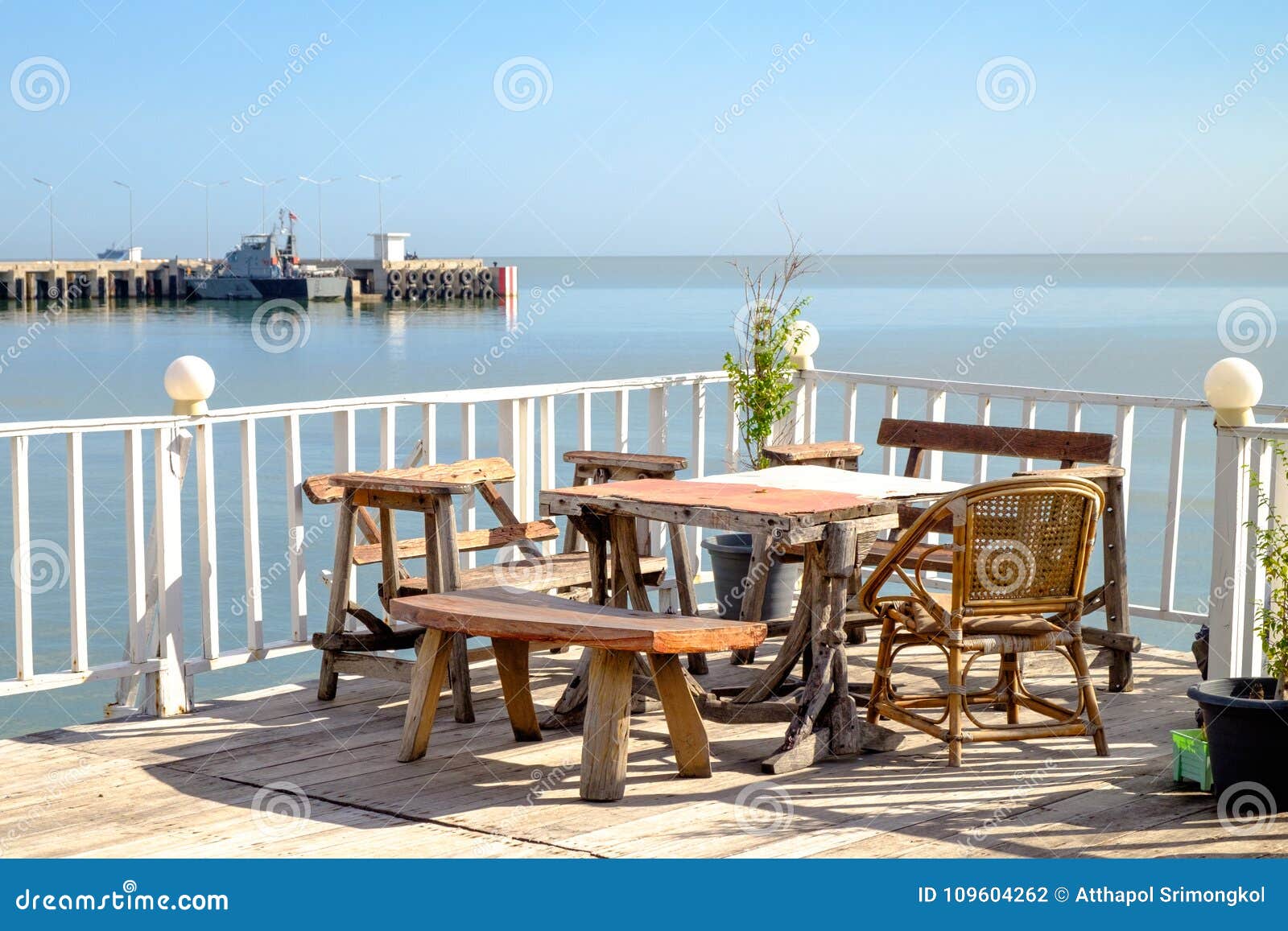 Tables And Chairs On The Porch That Extends Stock Photo Image Of