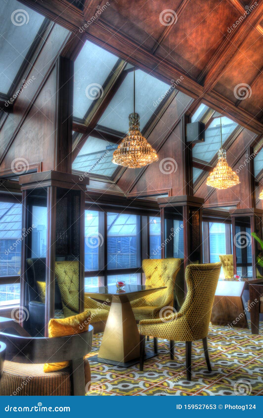 Tables and Lounge Chairs with Hanging Lights in a Comfortable Lounge