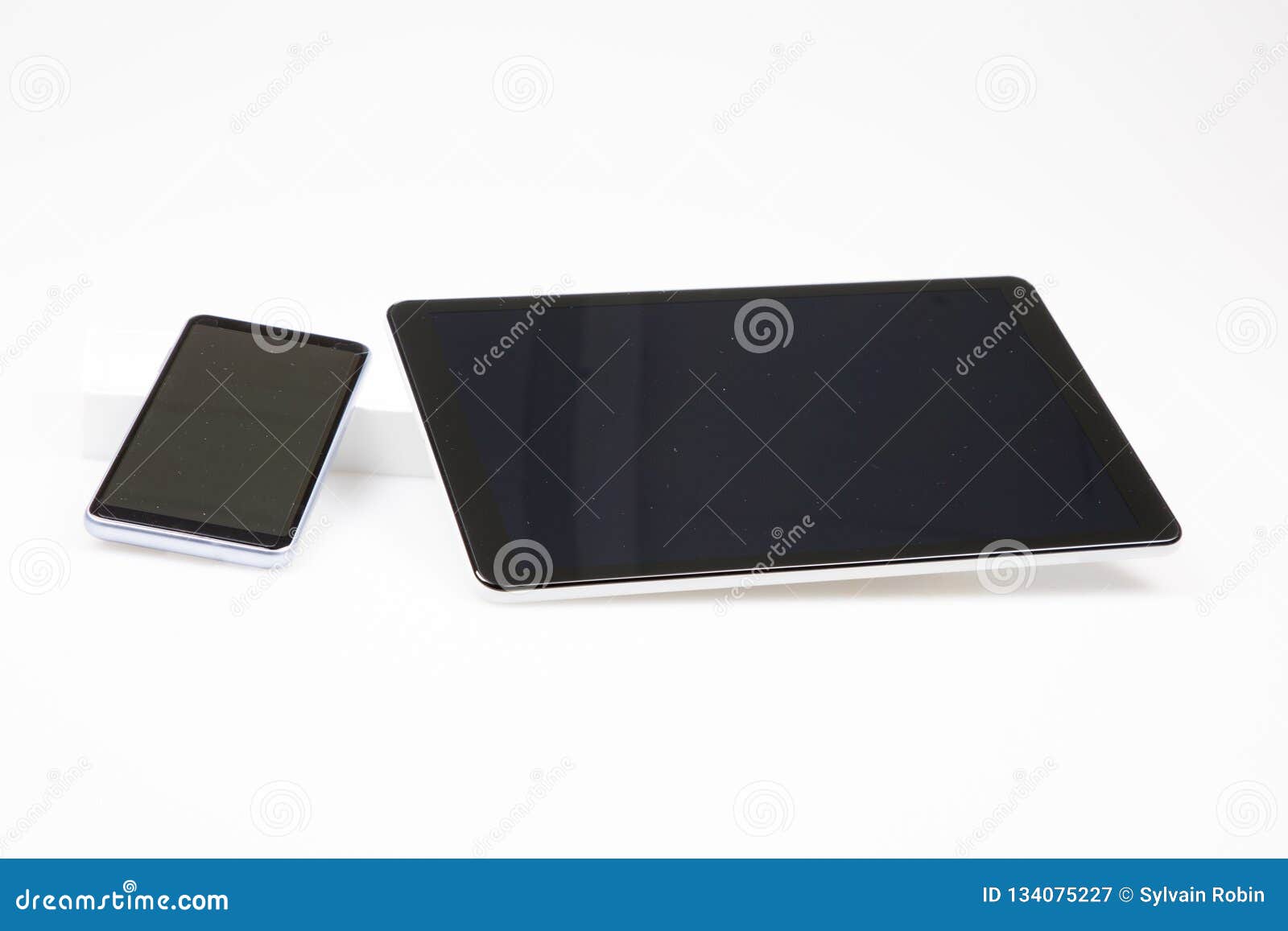 Tablet Computer in Landscape Orientation and Smartphone in Portrait