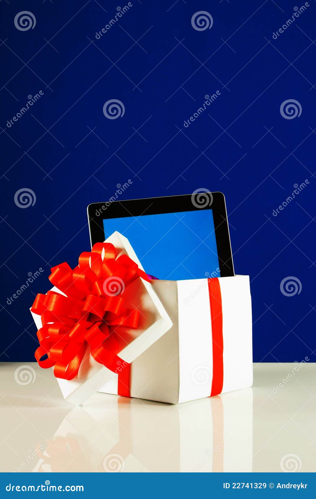 Tablet PC in a gift box stock image. Image of display 22741329