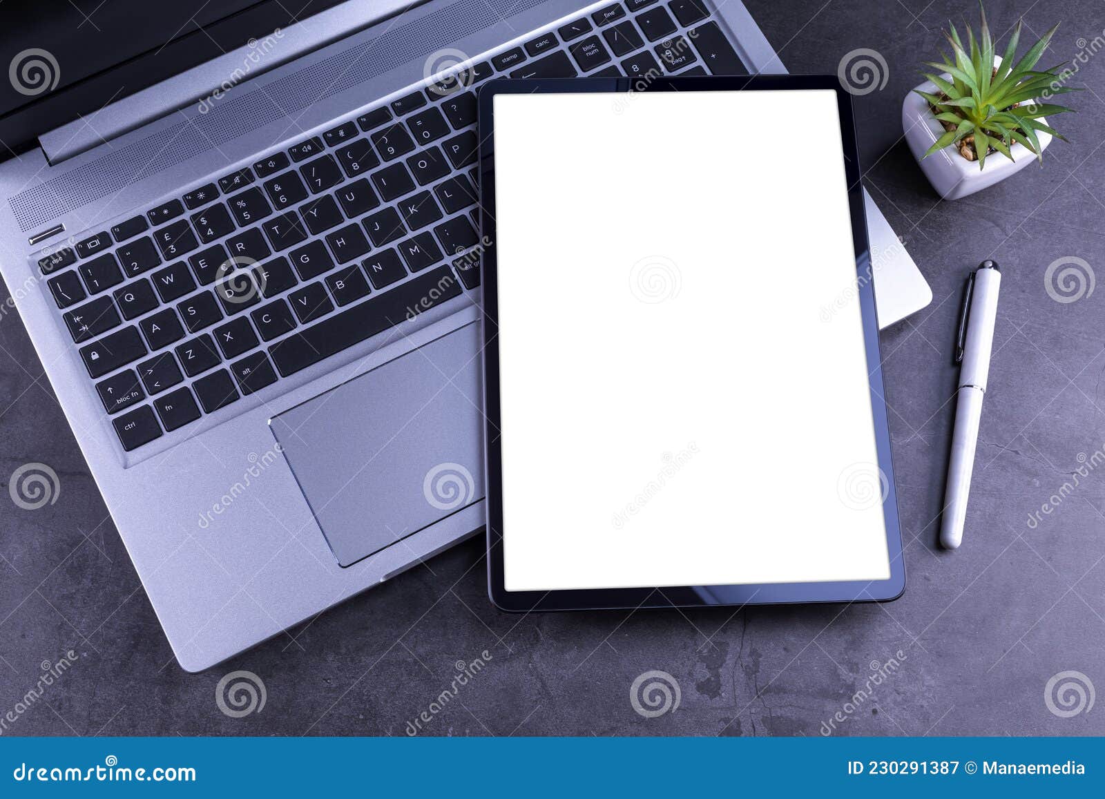 Tablet Pc Over Silver Laptop on Desk Stock Image Image of technology