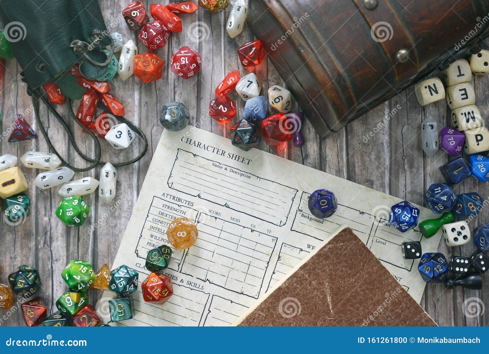 tabletop roleplaying flat lay with colorful rpg and game dices,  character sheet, rule book and treasure chest