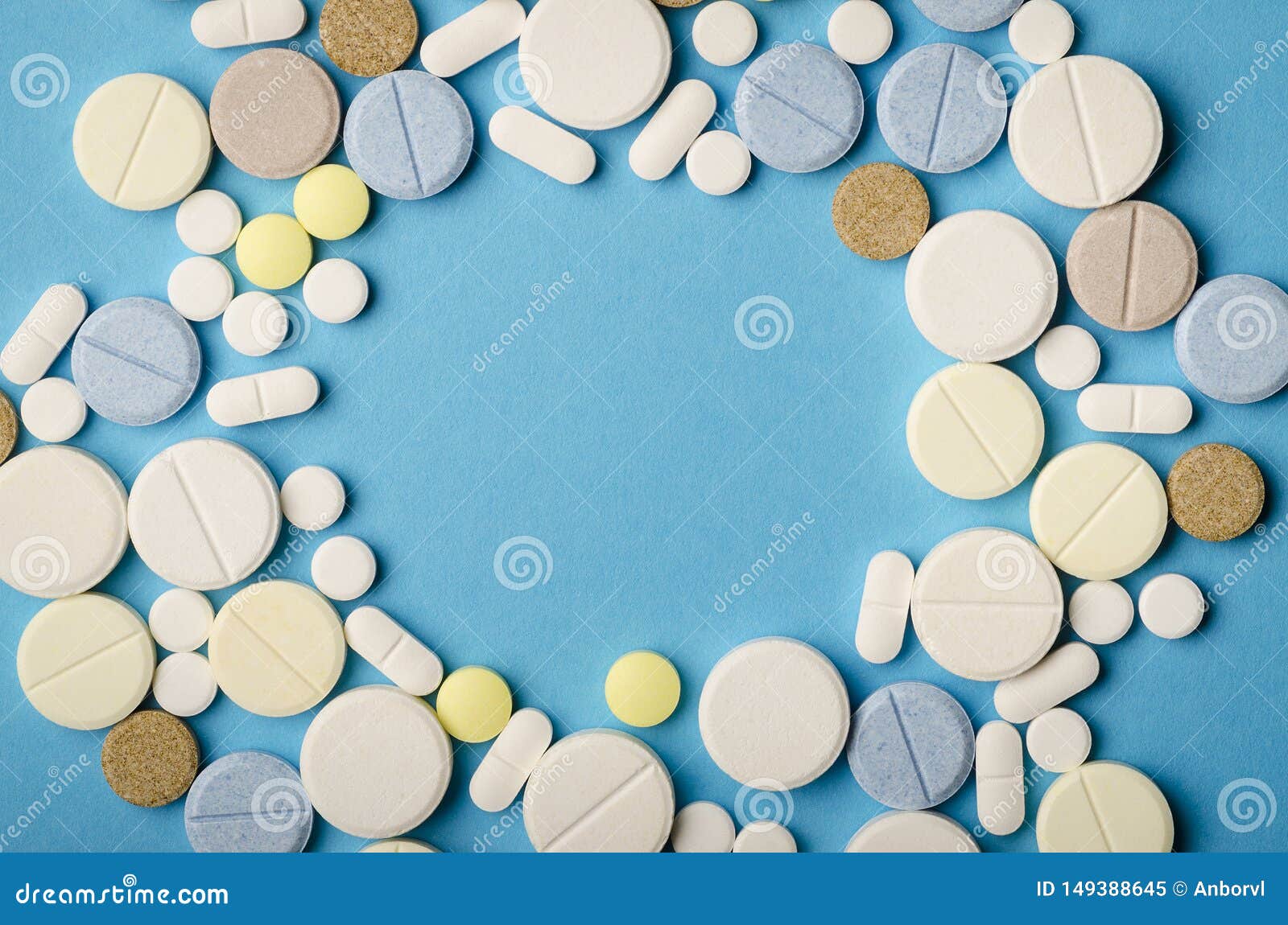 Tablets of Different Shapes on a Blue Background Closeup, Empty Space