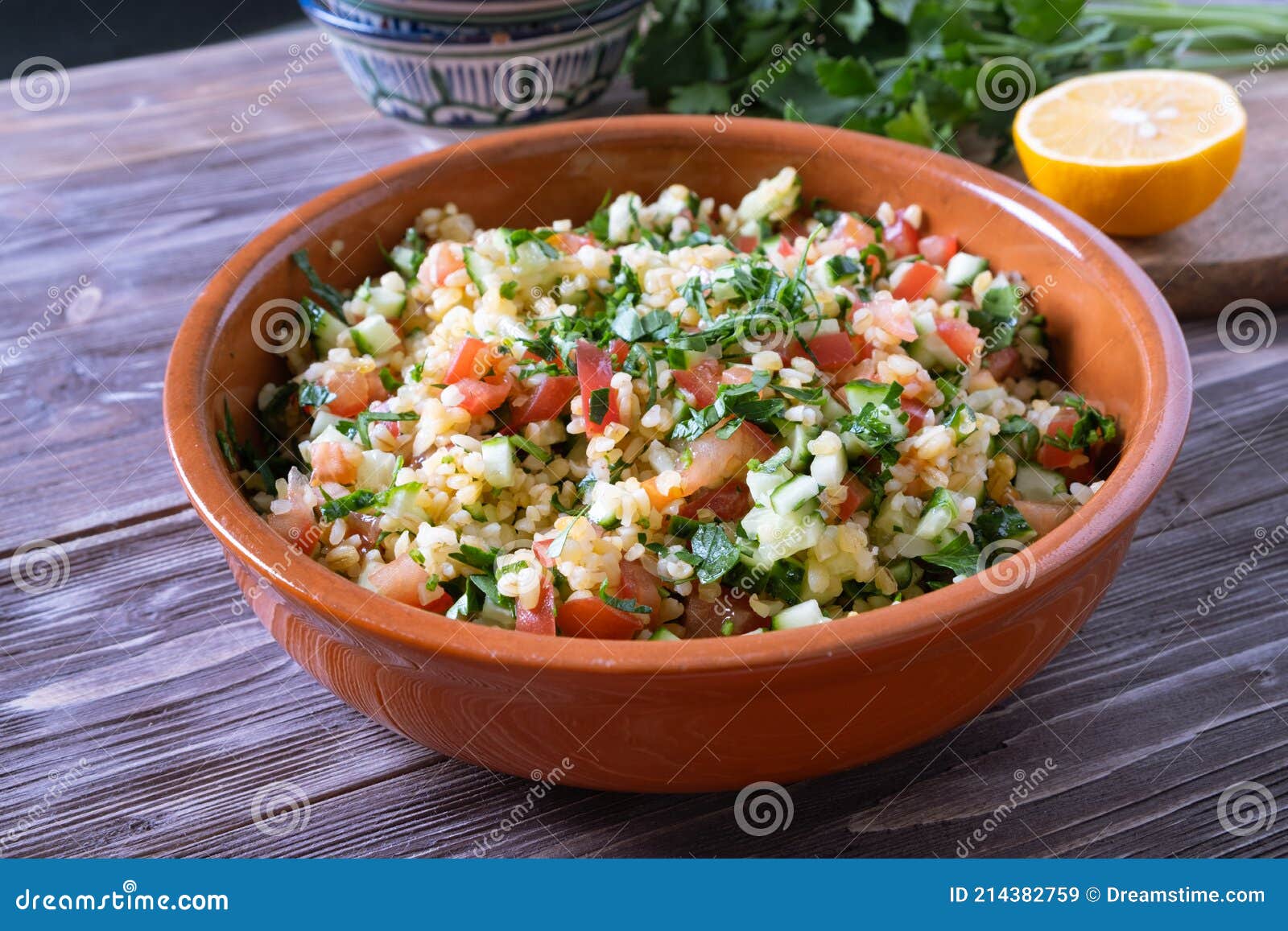tabouli salad or tabule, tabbouleh - simple mediterranean salad with vegetables and bulgur.