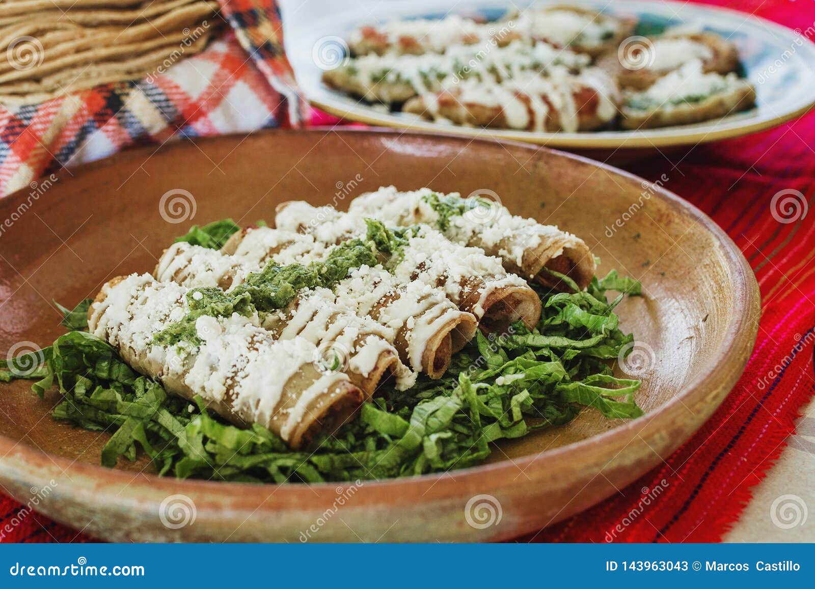 tacos dorados, flautas de pollo, chicken tacos and spicy salsa homemade mexican food in mexico