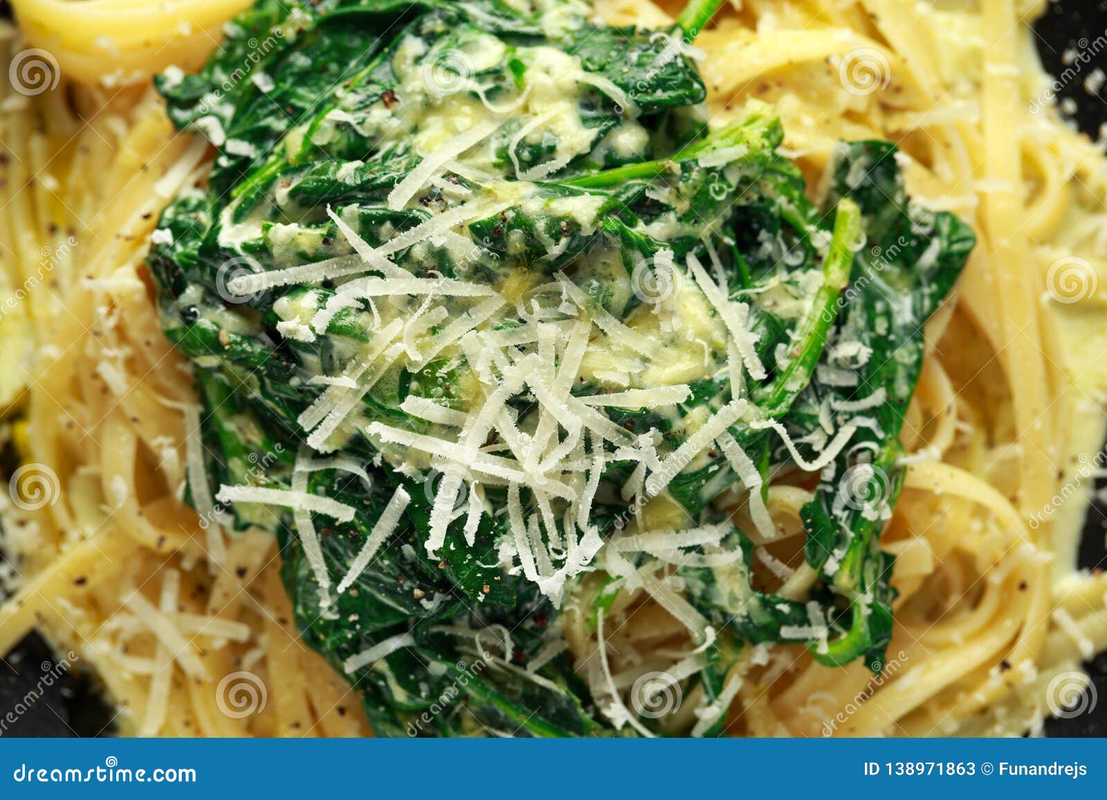 Tagliatelle Pasta with Spinach in Cream Sauce with Parmesan Stock Image