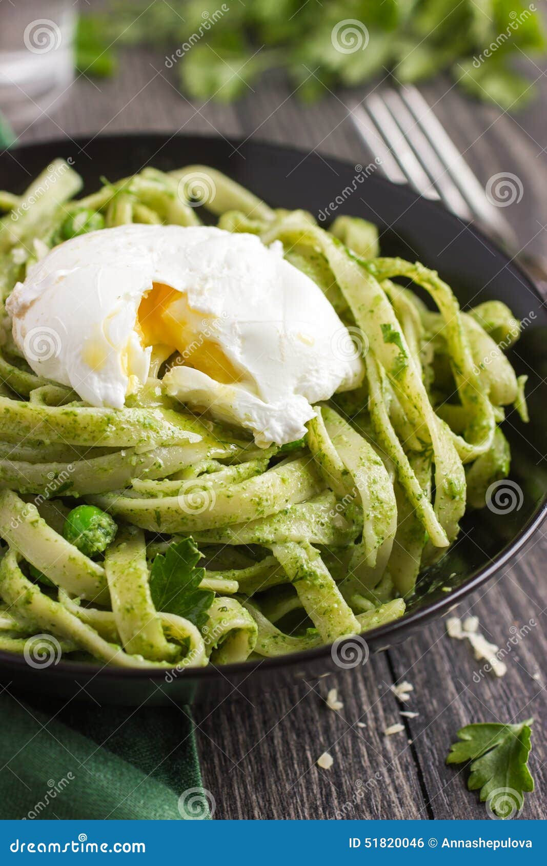 Tagliatelle Pasta with Spinach and Green Peas Pesto Poached Egg Stock