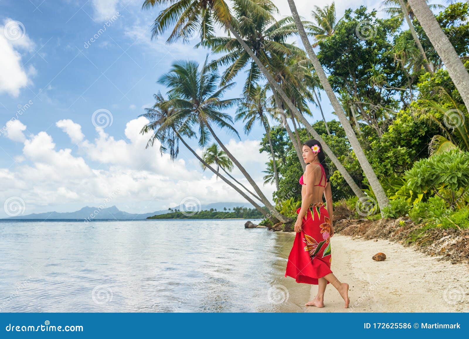 Voyeur. Slim girl on a public beach. back view