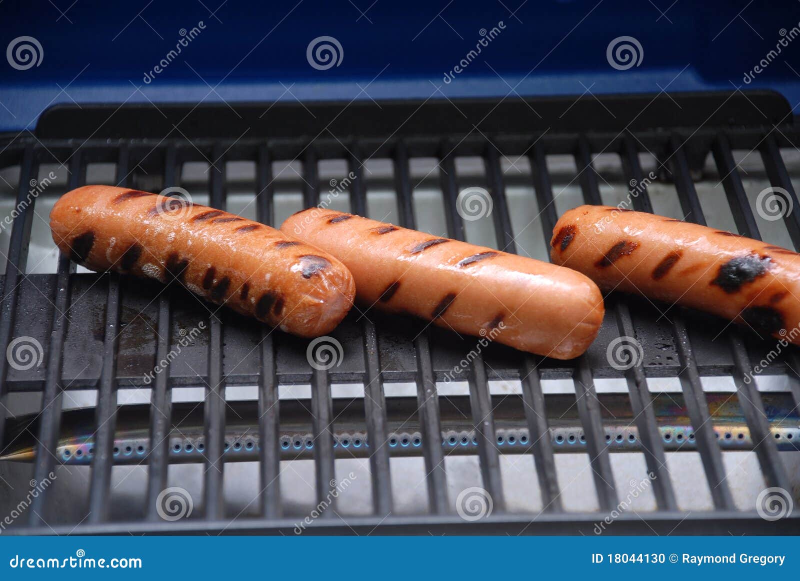 Tailgate Grilling Hot Dog or Franks Time. Stock Photo Image of heat