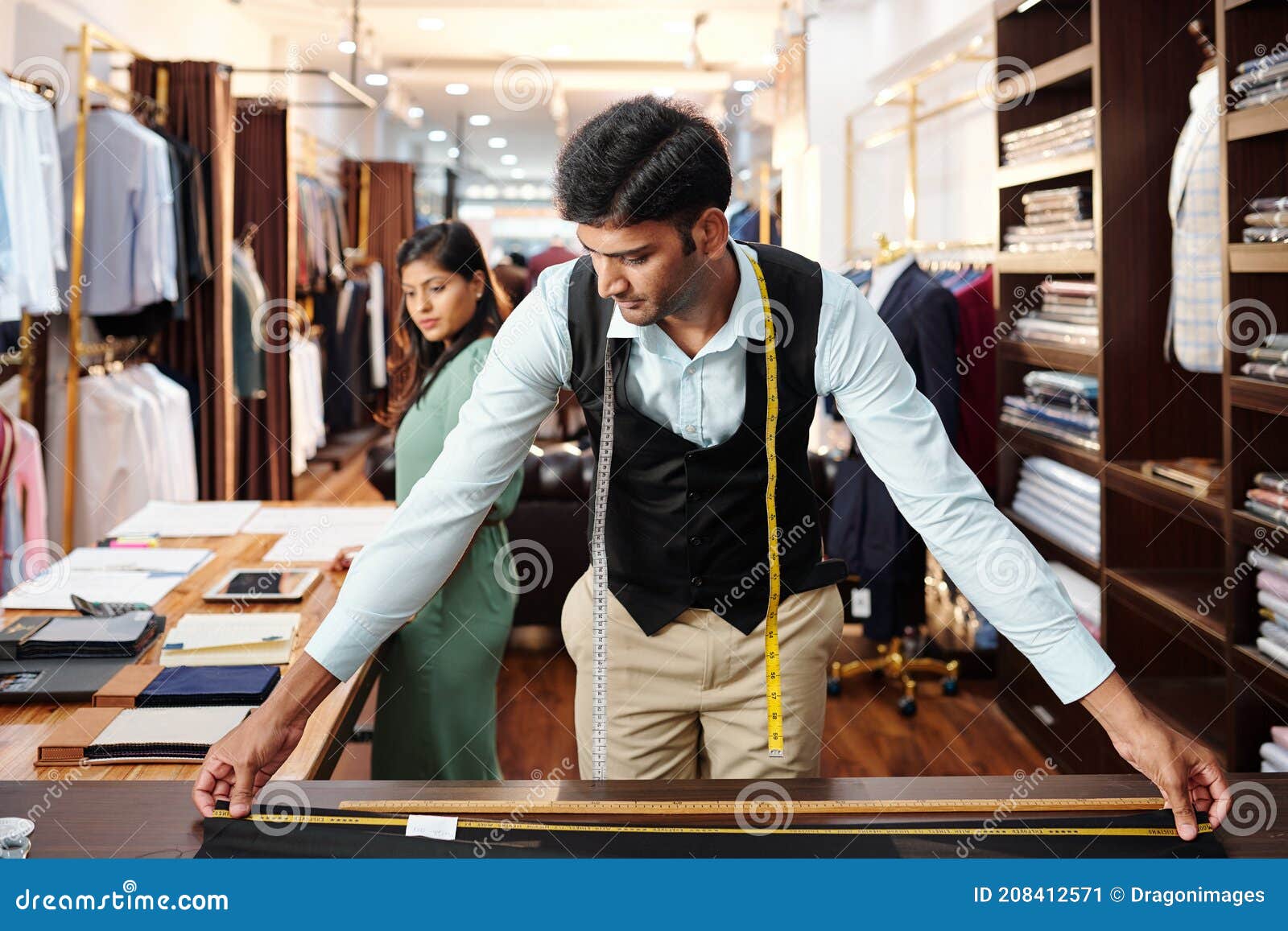 Tailor measuring fabric stock image. Image of atelier 208412571